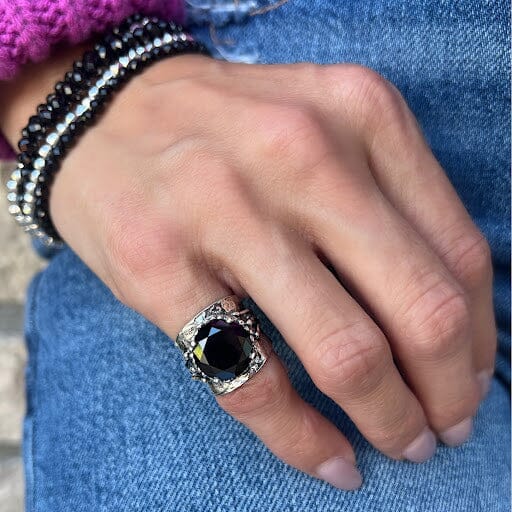 chunky pinky ring featuring a prong set onyx stone