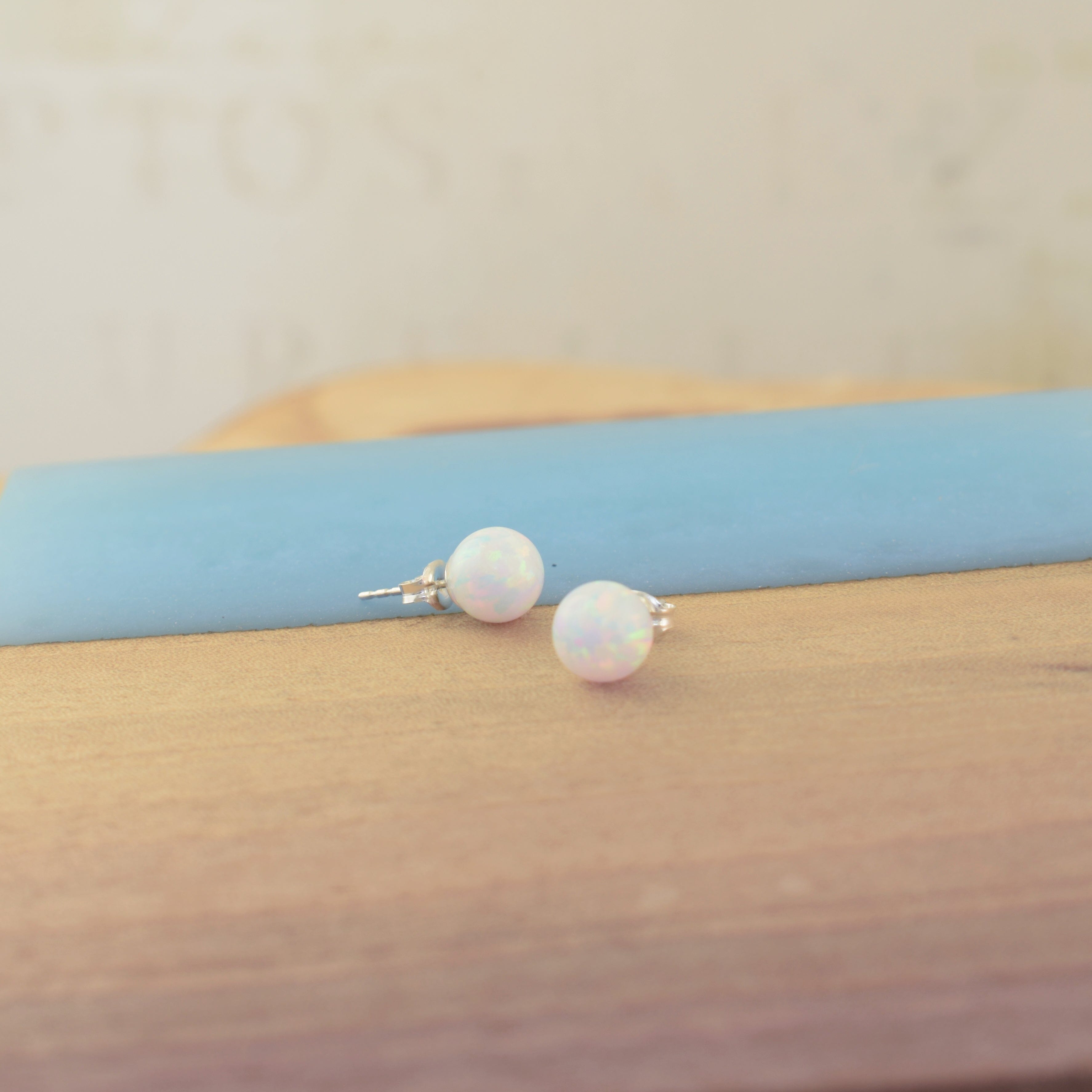 Pair of white opal stud earrings