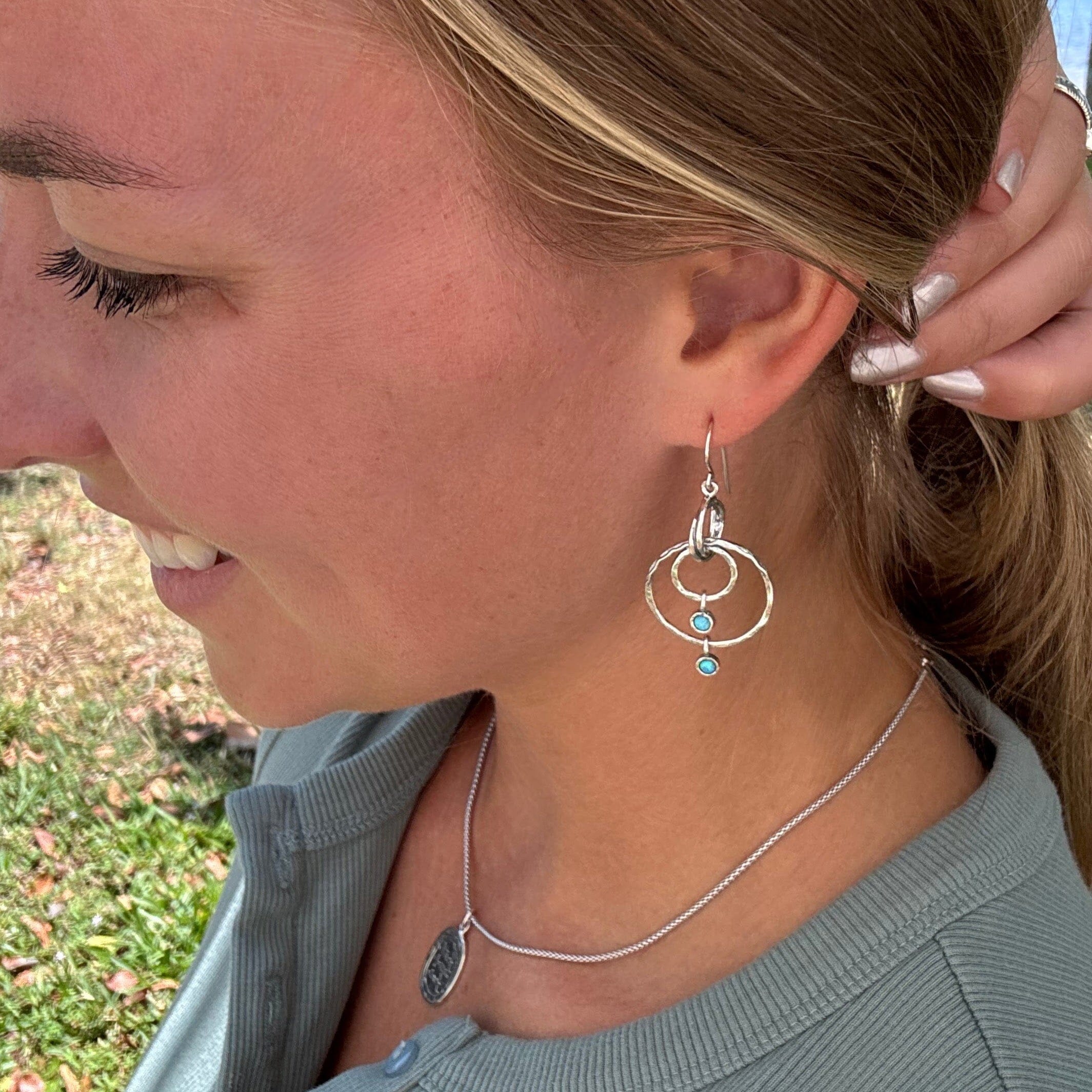 silver oxidized dangling earrings with two blue-green opal stones