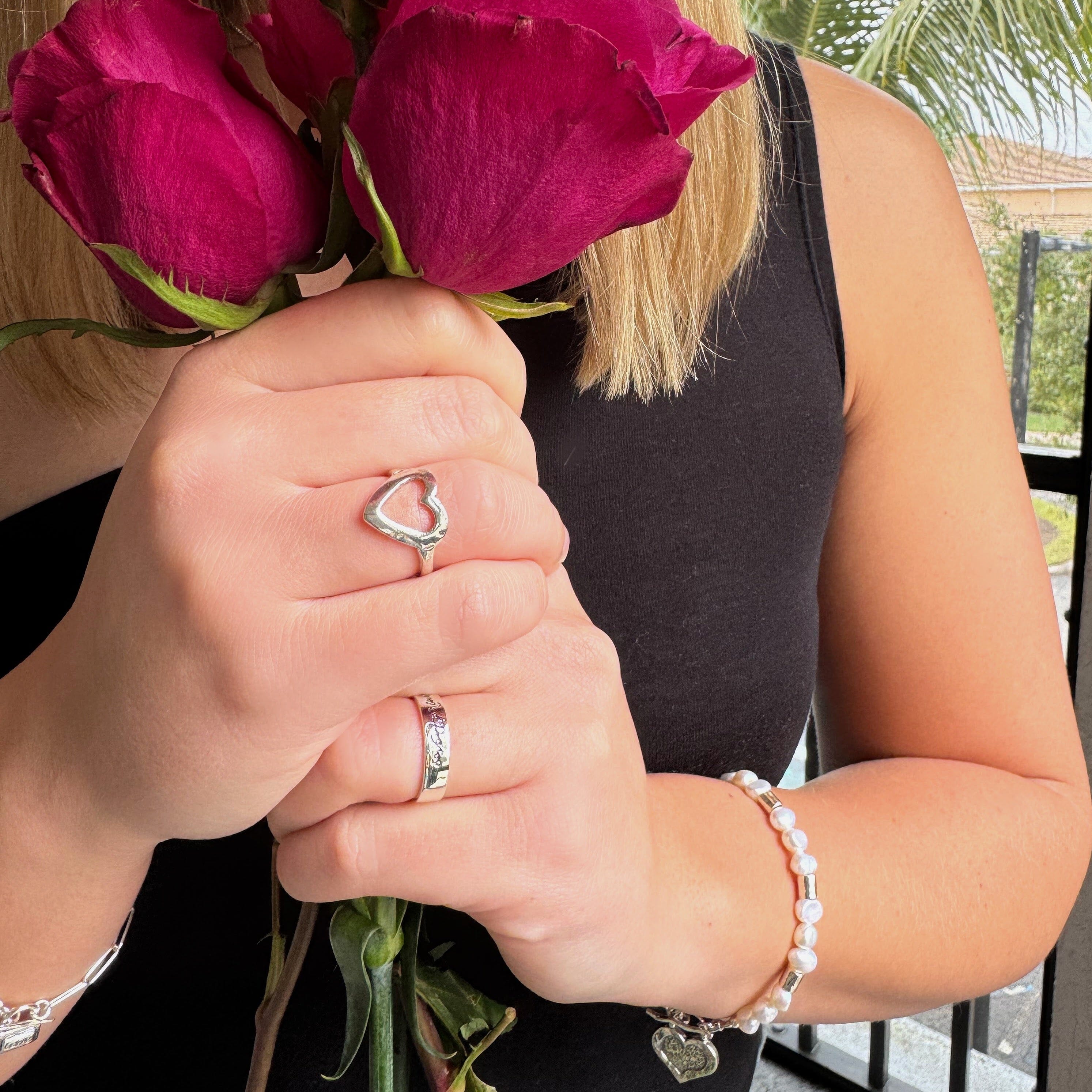 Open Heart sterling silver ring paired with the Seventy X Seven ring