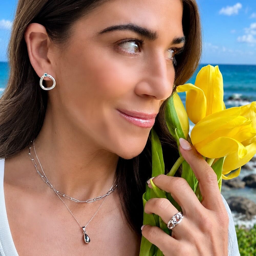 .925 earrings with a aqua blue stone