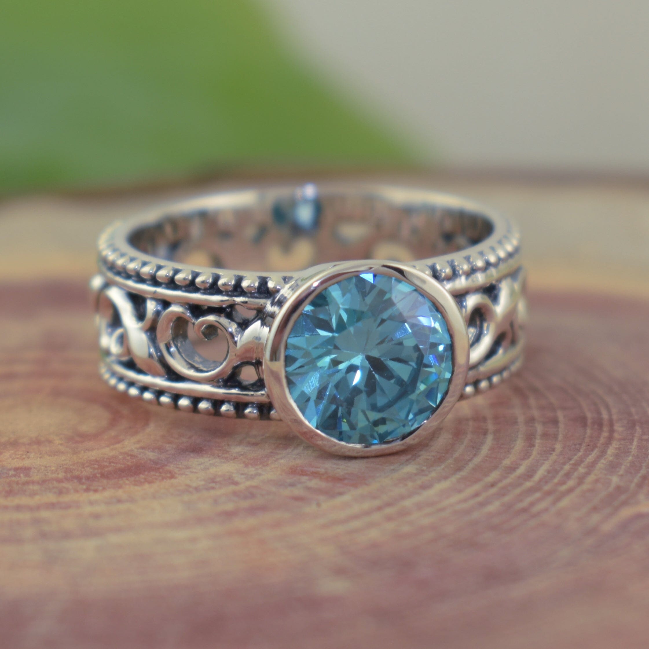 Handcrafted sterling silver ring featuring aquamarine blue center cz stone