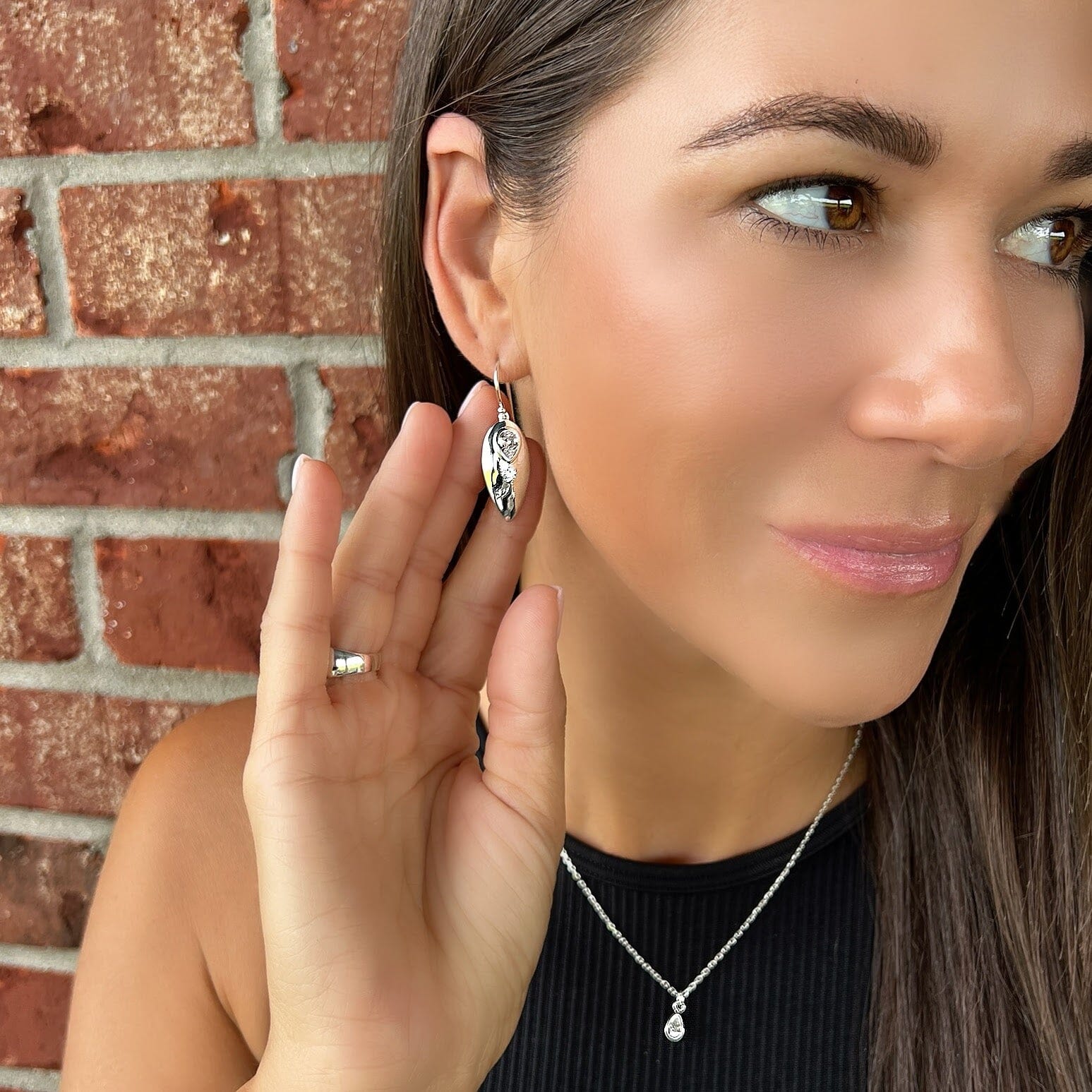 leaf shaped earrings with a drop shape clear CZ stone