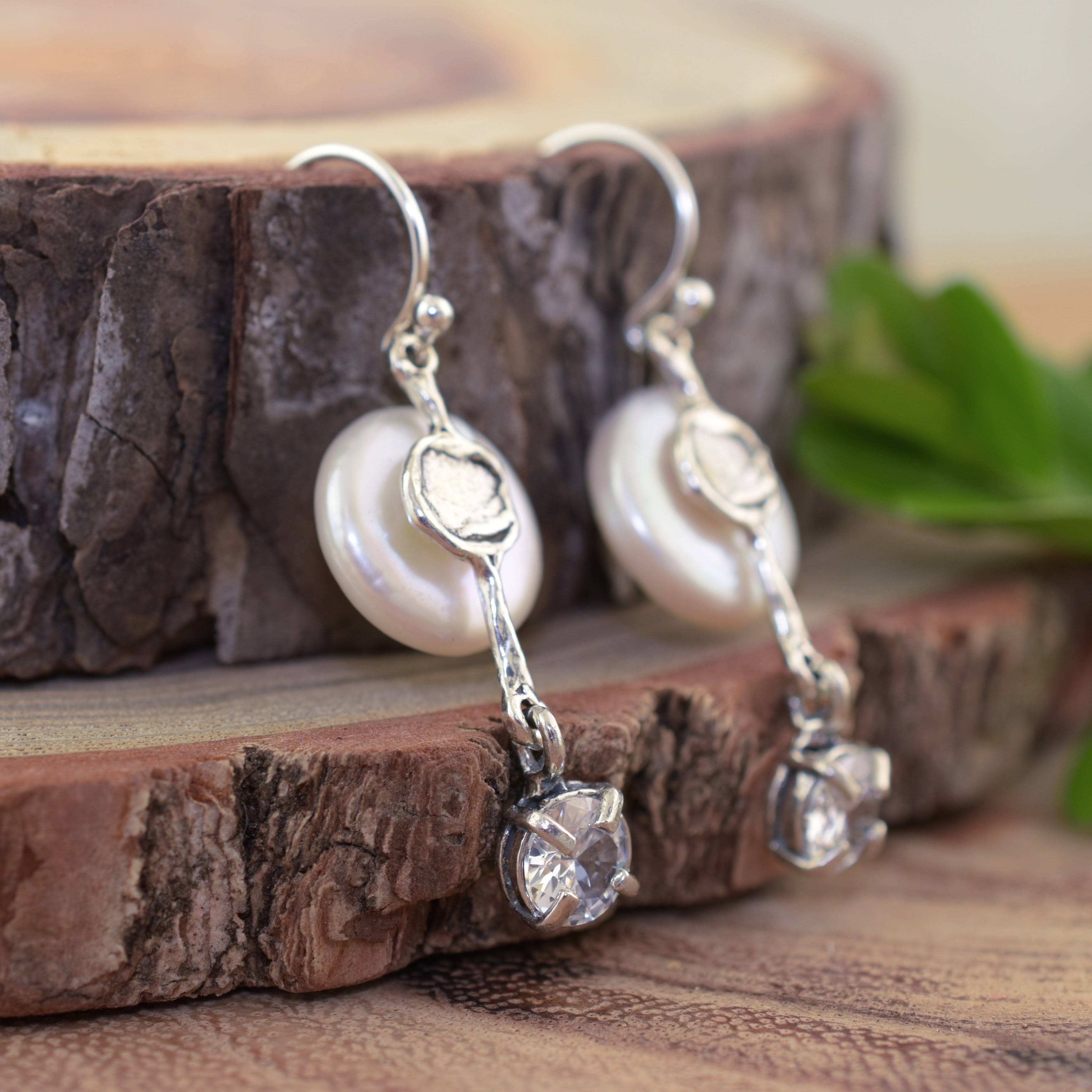 Sterling silver earrings with a prong set clear CZ stone