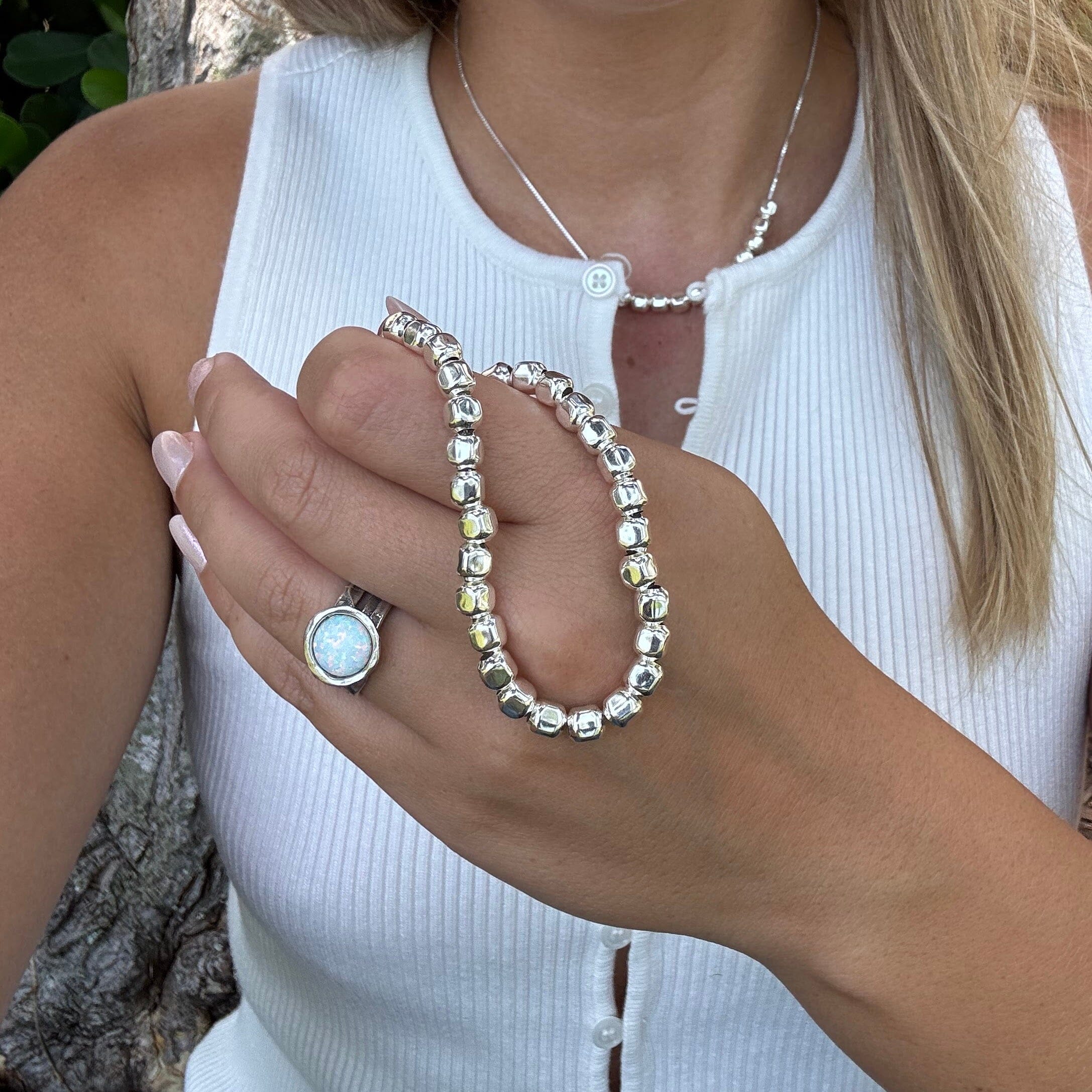 rounded bead bracelet paired with the pebble parade necklace and white opal ring