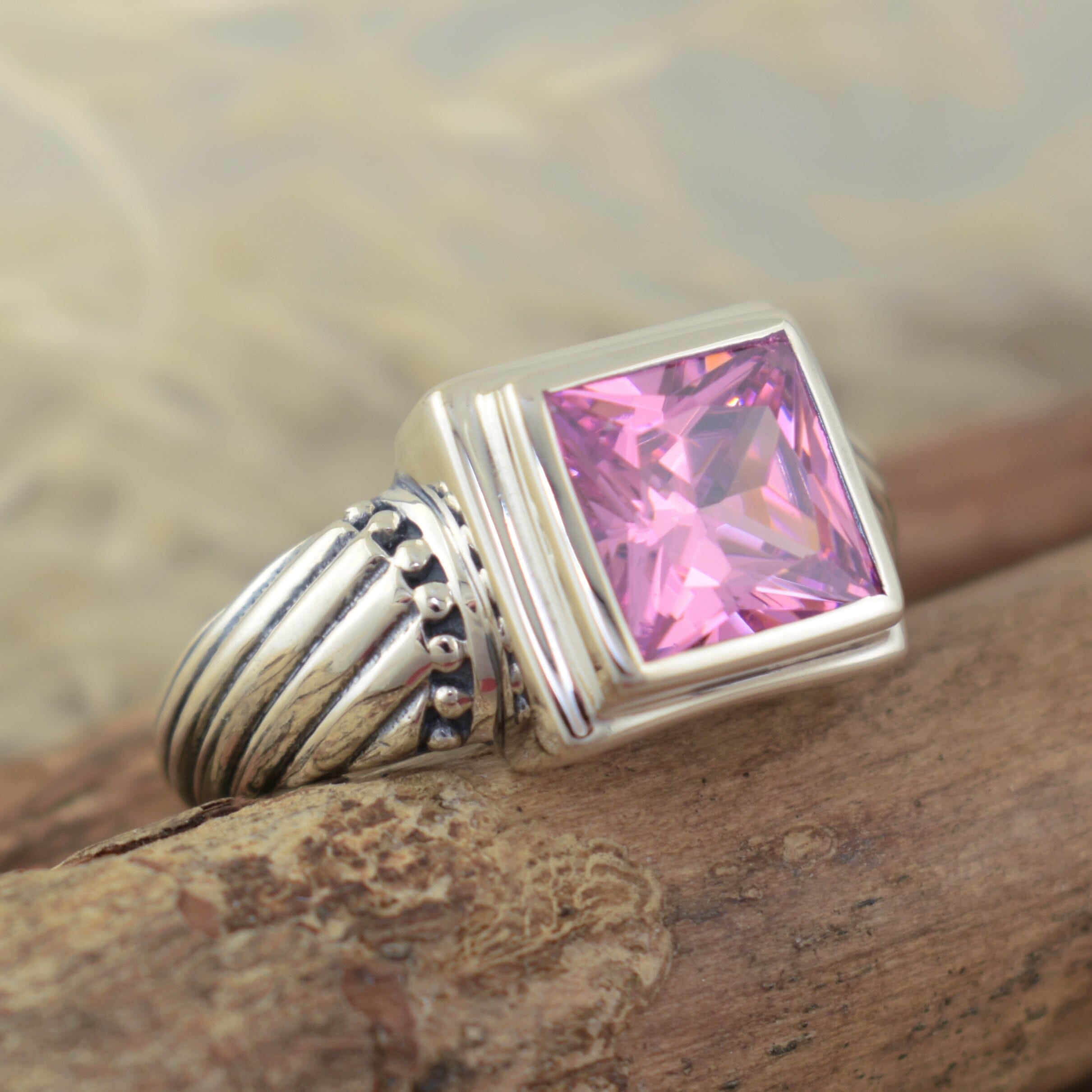 high polished sterling silver ring with square pink cz center