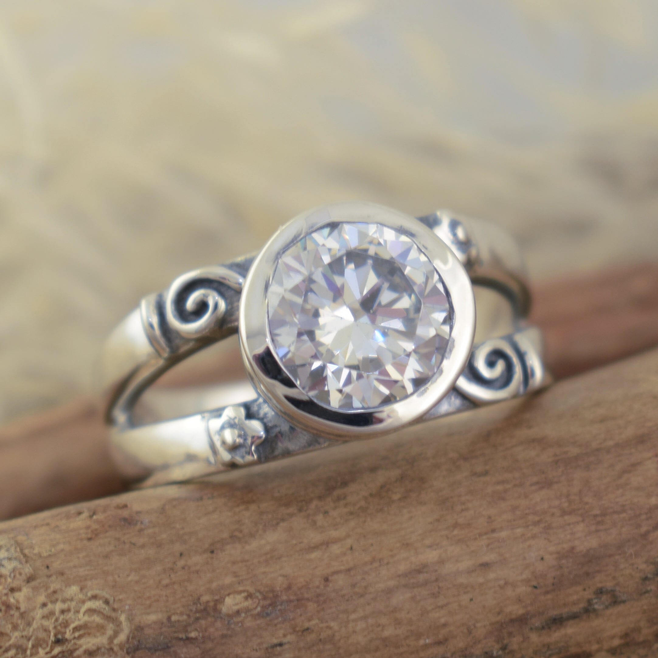 sterling silver cz ring featuring designer swirls and flowers on the band