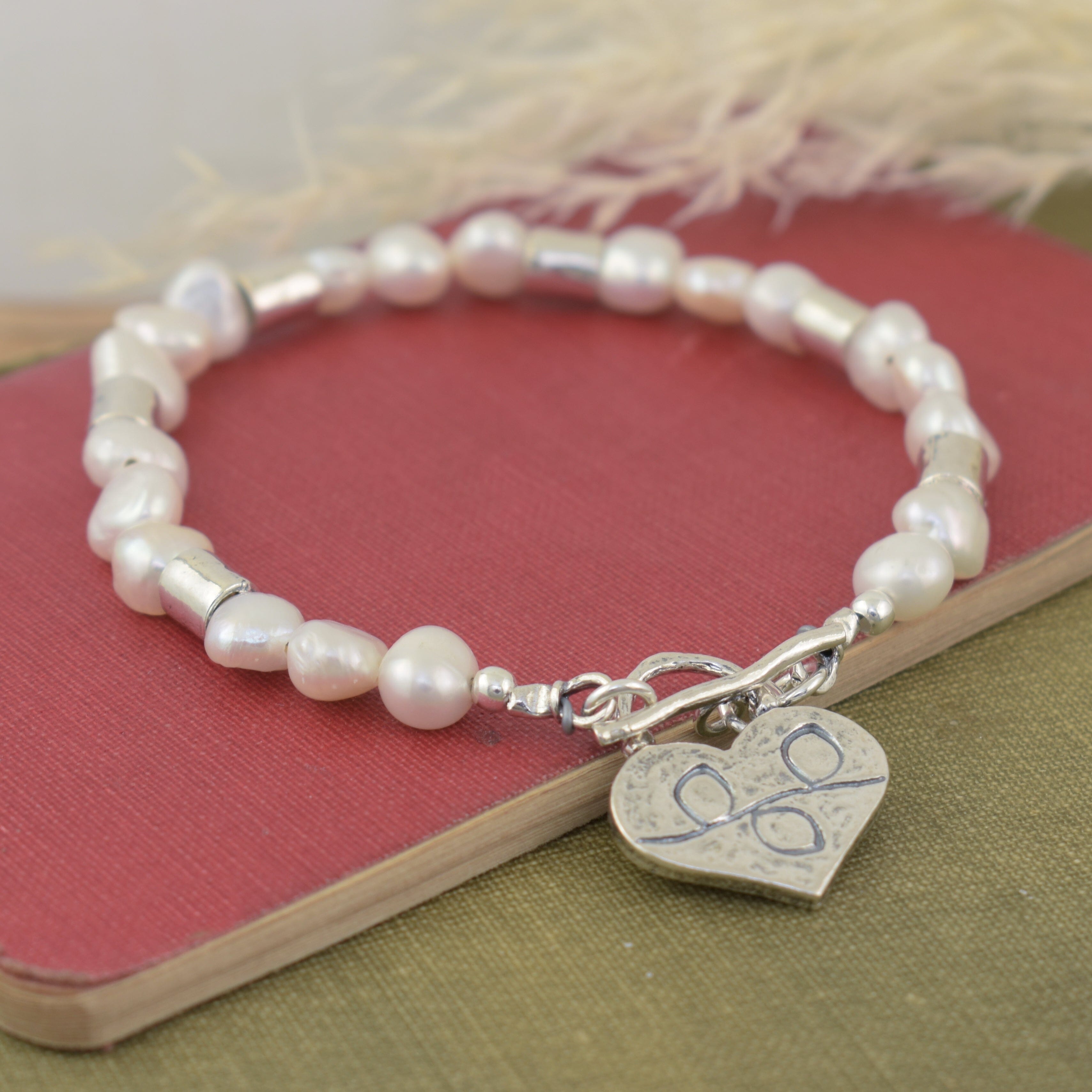 heart-shaped toggle clasp freshwater pearl bracelet with vine details