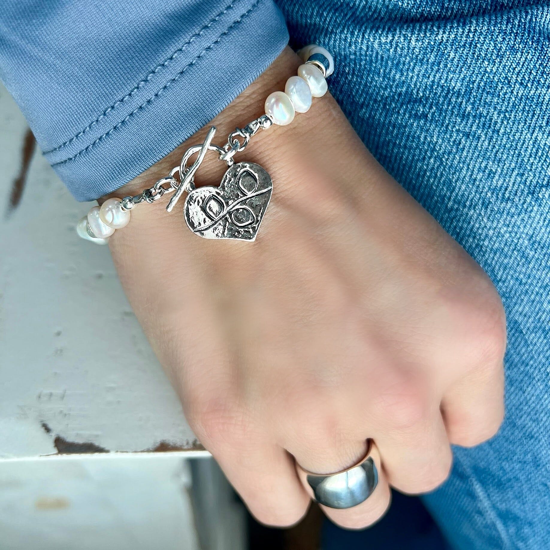 sterling silver heart charm bracelet with freshwater pearls