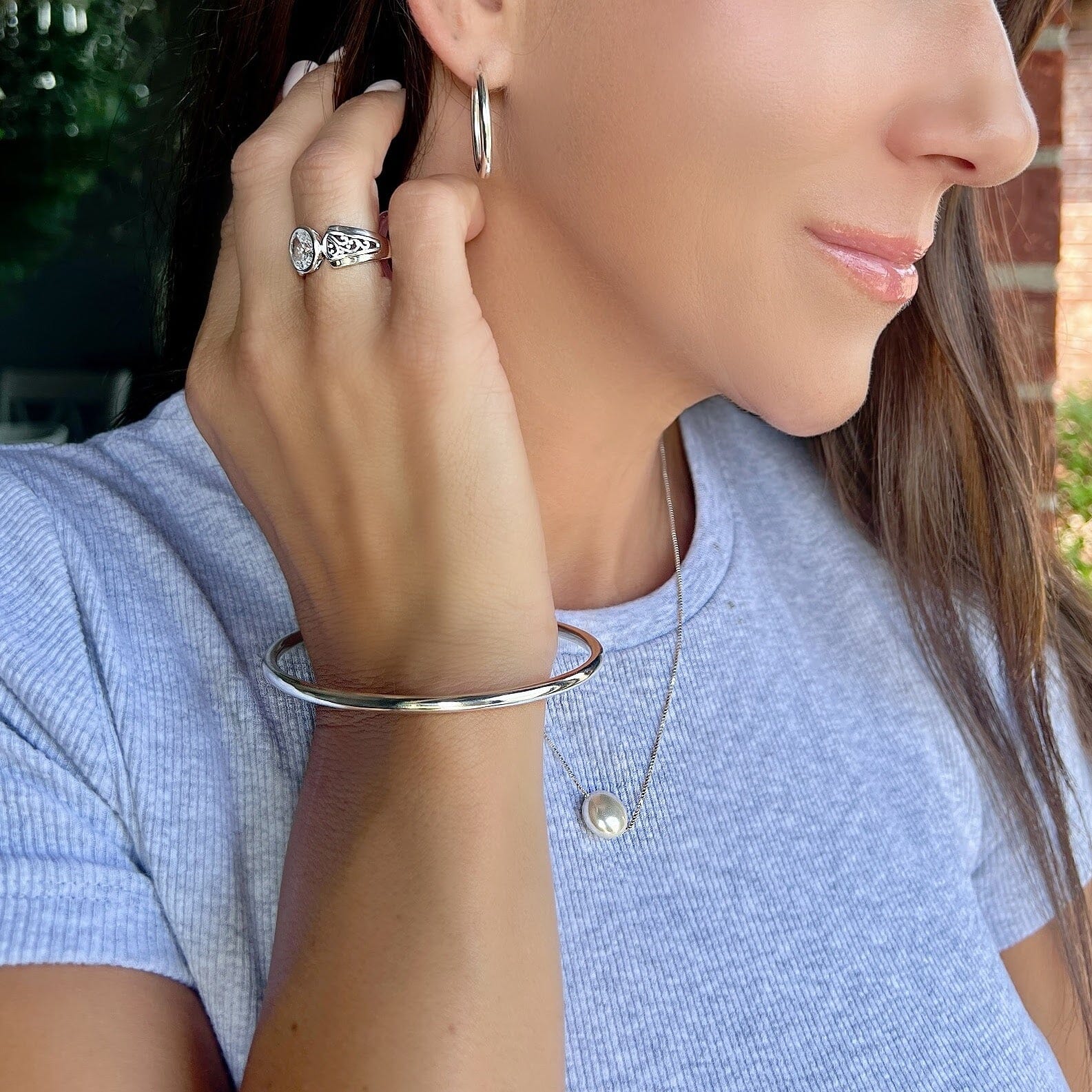 polished bangle paired with the radiant filigree ring, Cliff hanger earrings and the seaside  necklace