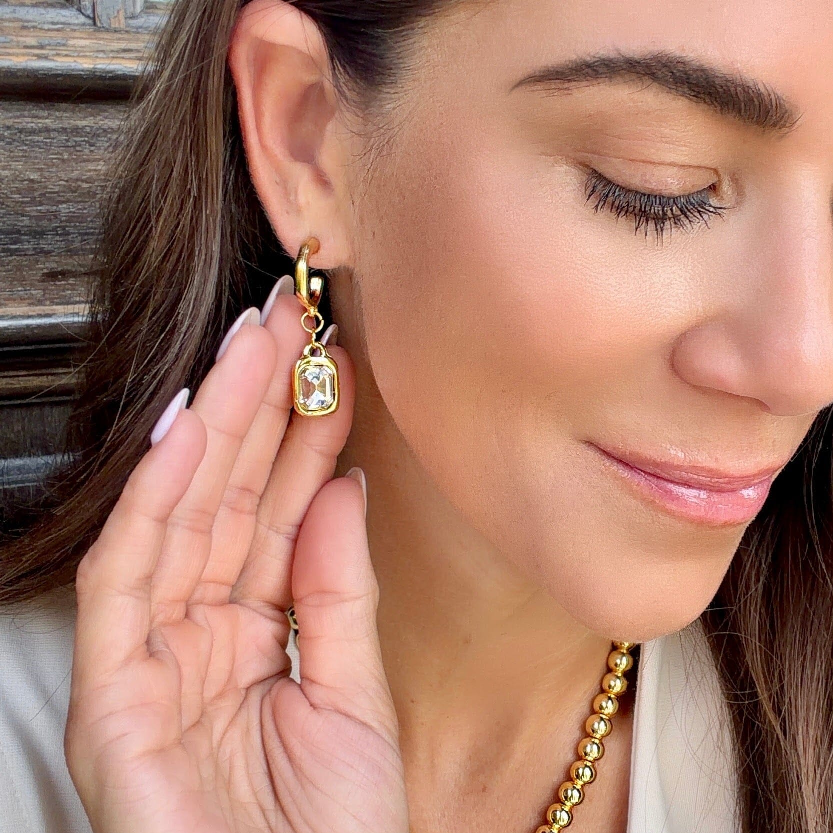 gold zamak earrings with a cz dangle