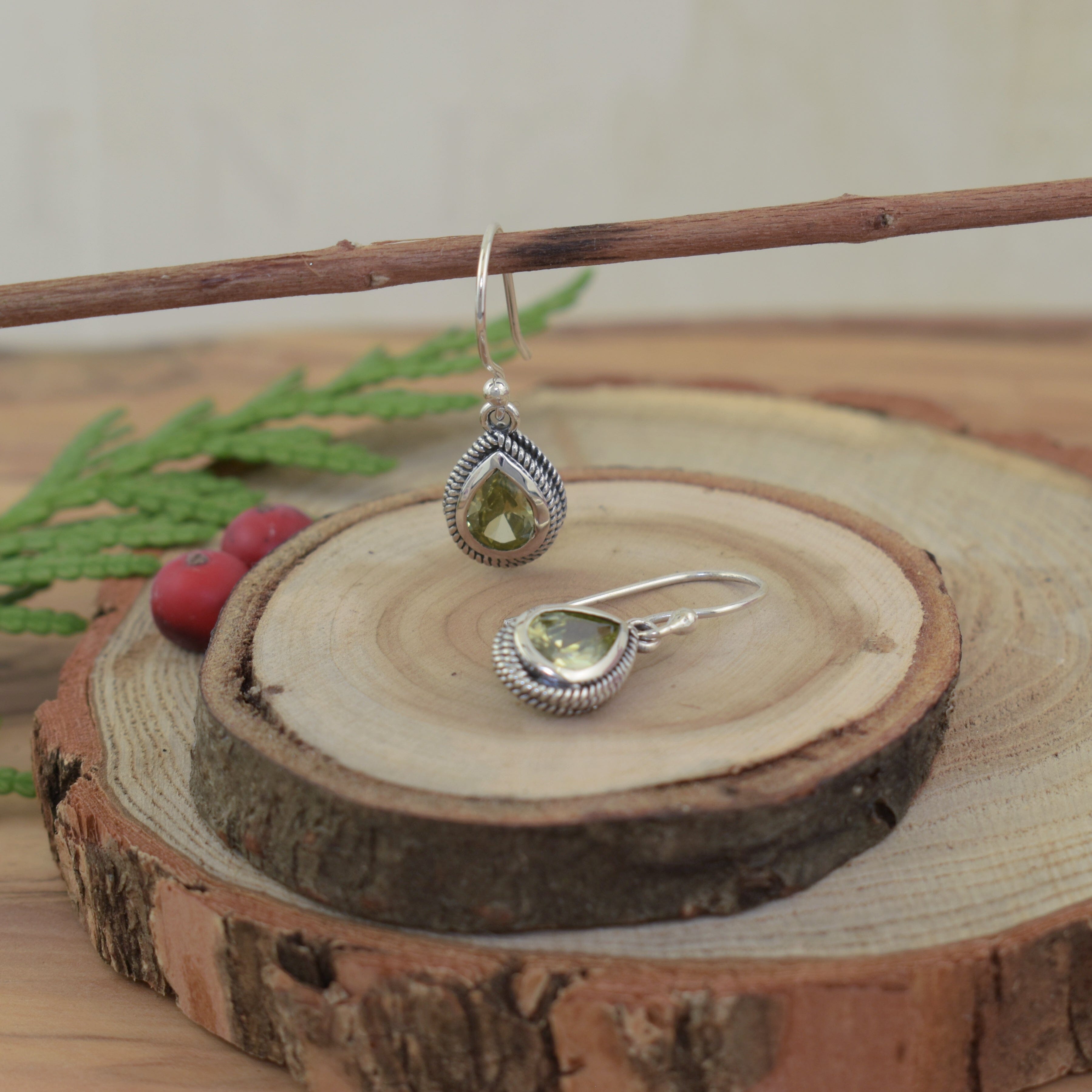 pear shape peridot earrings in sterling silver