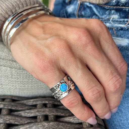 wide spinner opal ring bezel set in sterling silver