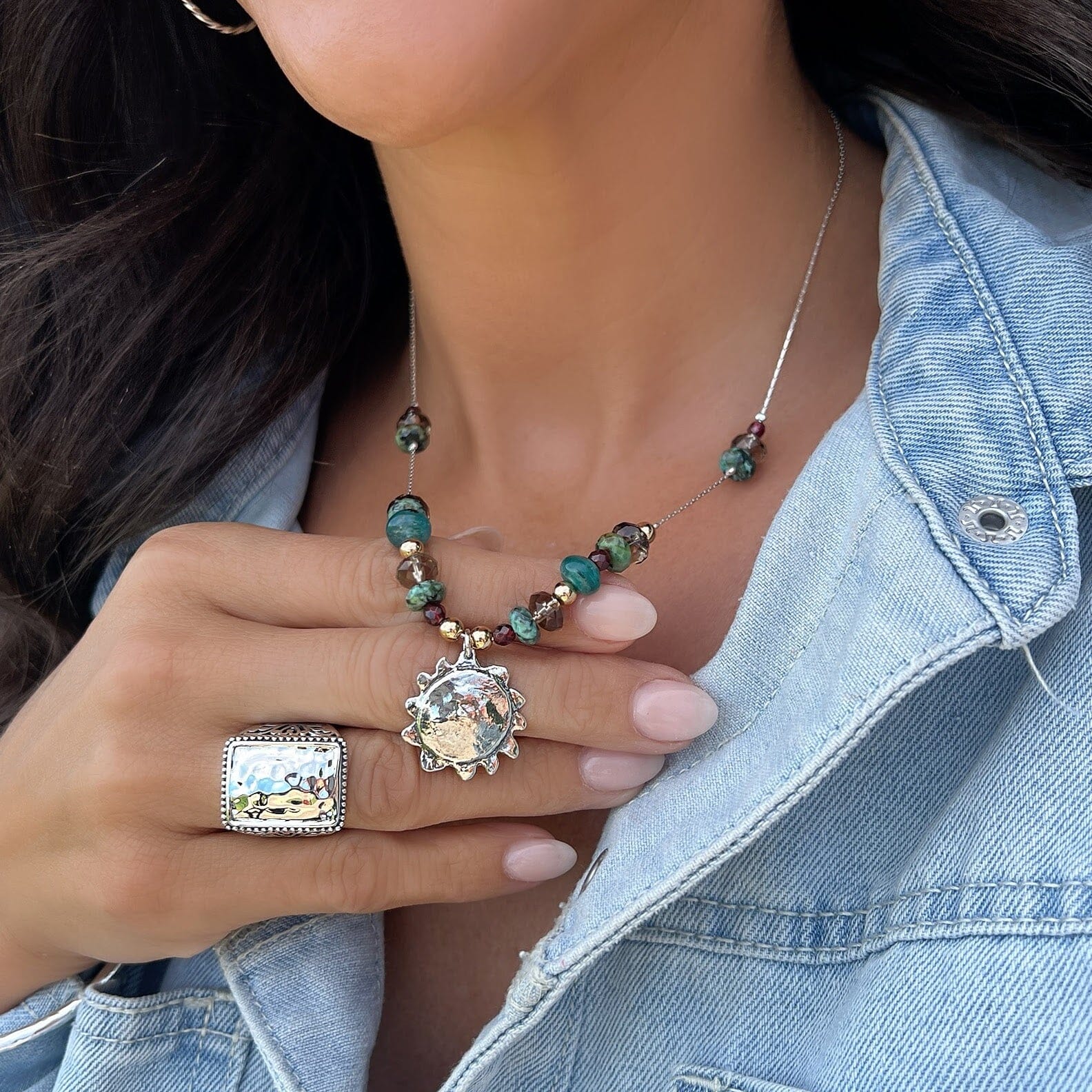 sterling silver sun necklace featuring Garnet, Turquoise, Kyanite, Hematite, and Smoky quartz