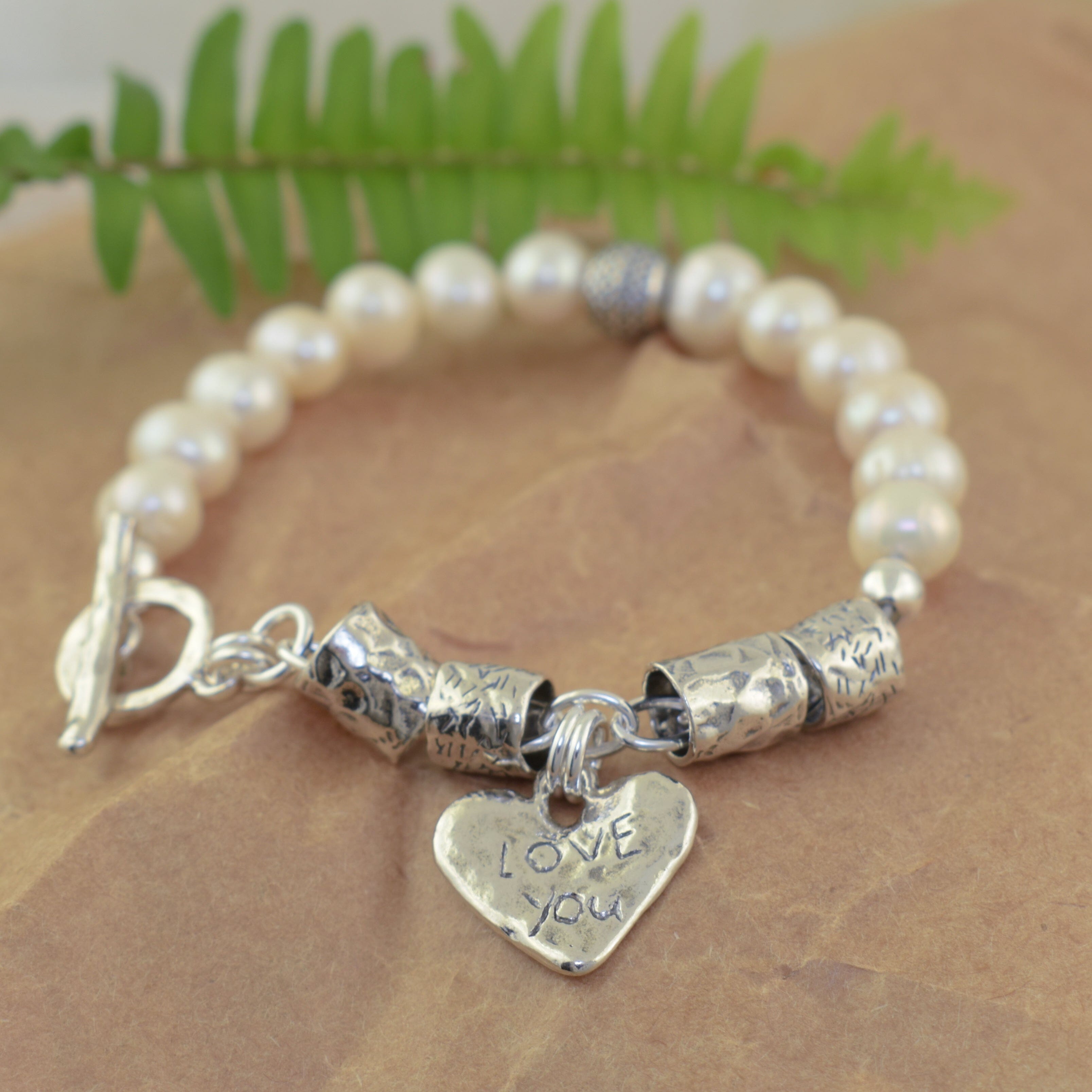 .925 sterling silver and freshwater pearl toggle bracelet featuring heart dangle charm
