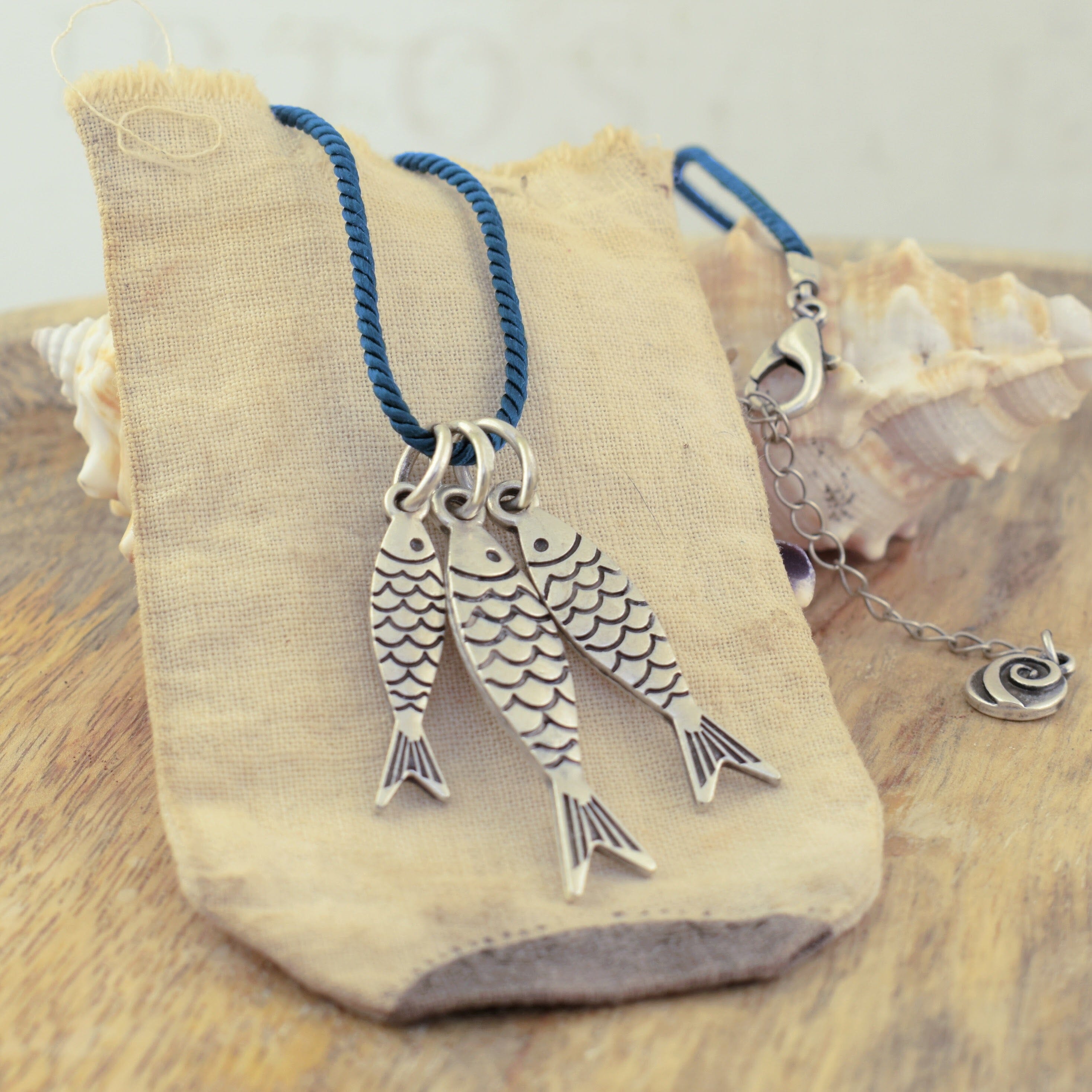 Fish necklace with colored cord 