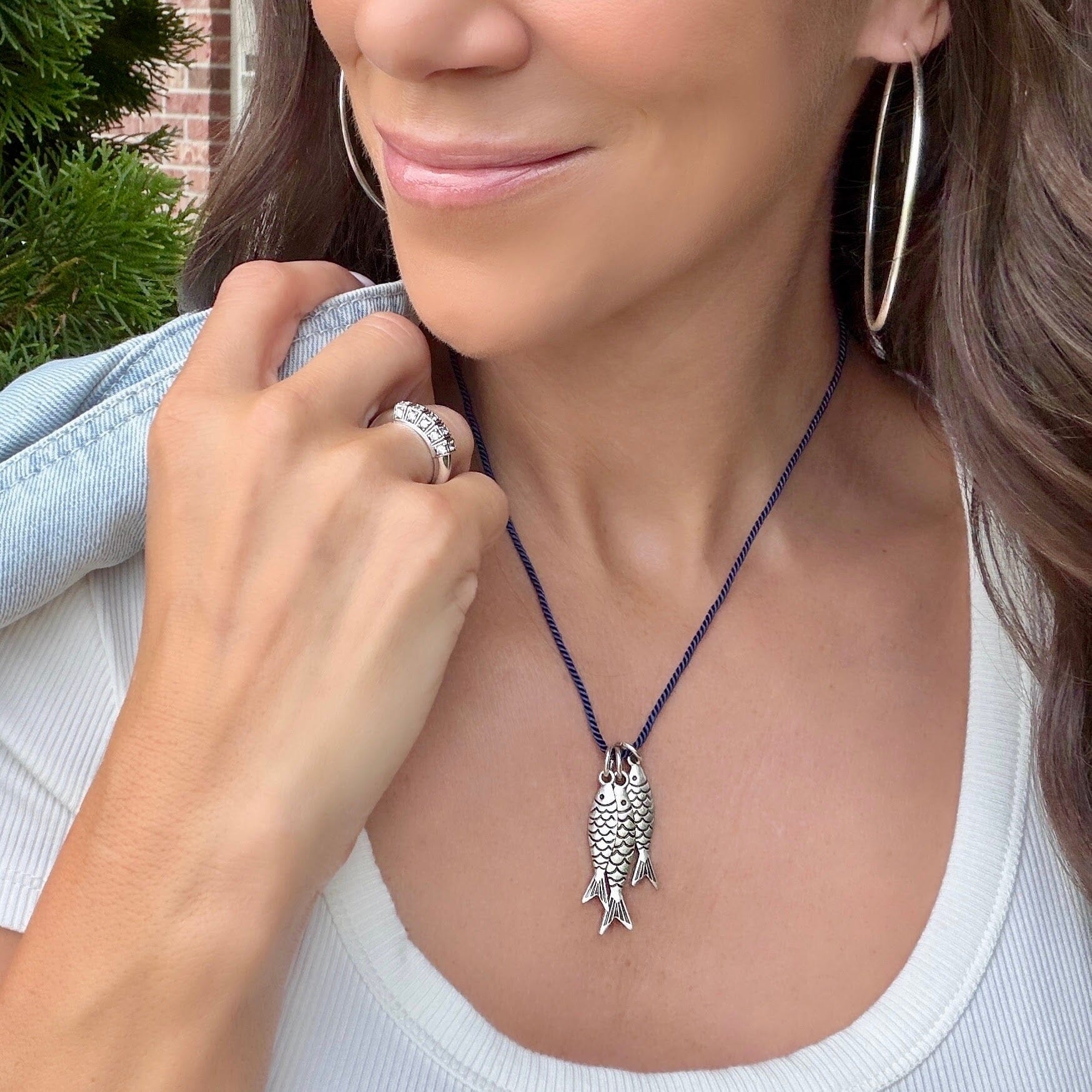 navy blue cotton cording necklace with three fish pendants