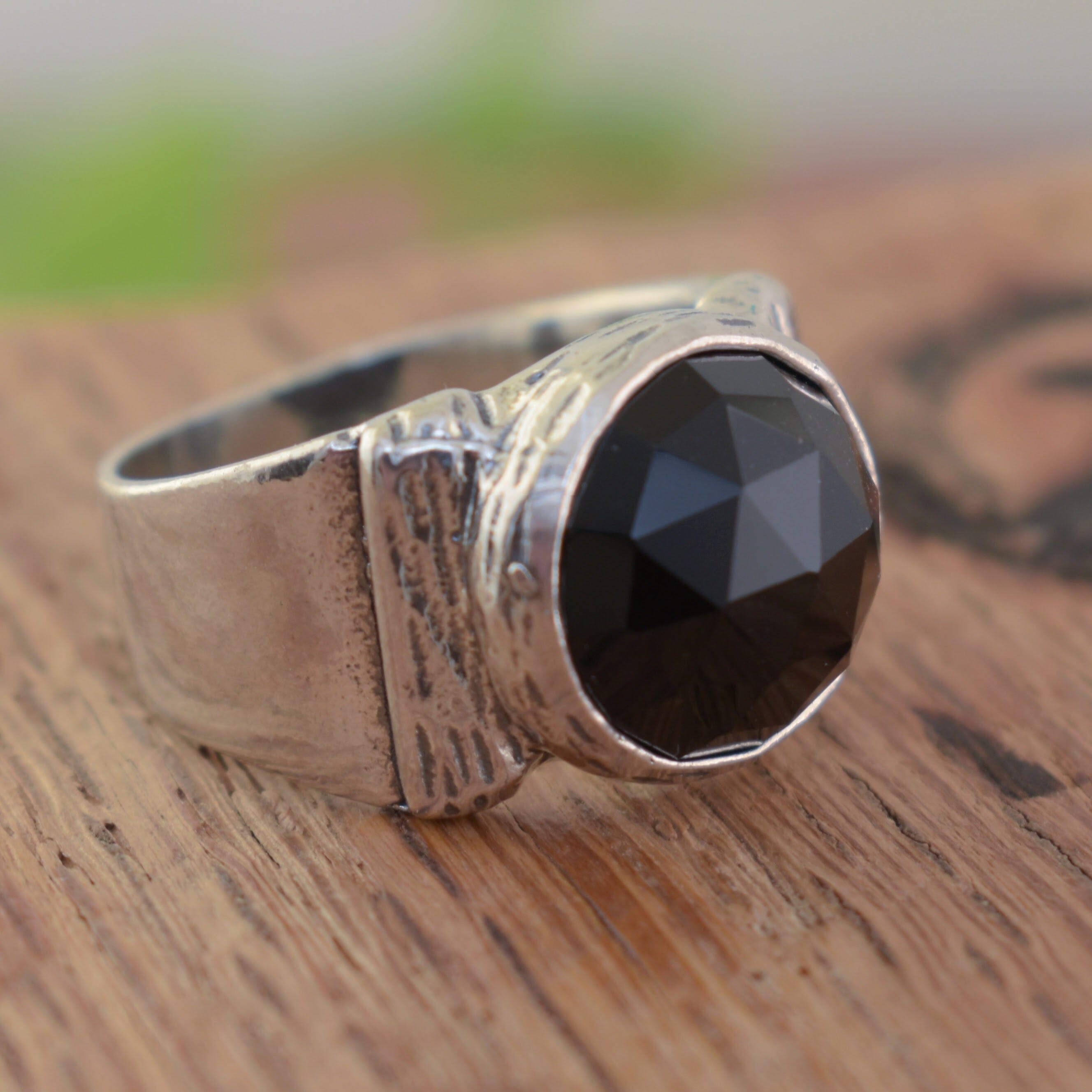 Handcrafted antiqued sterling silver ring featuring round black onyx stone