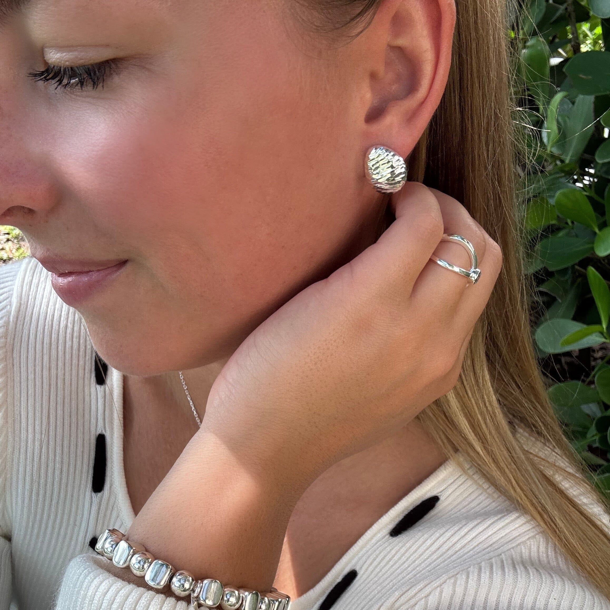 sterling silver push back post earrings with a ripple-like design
