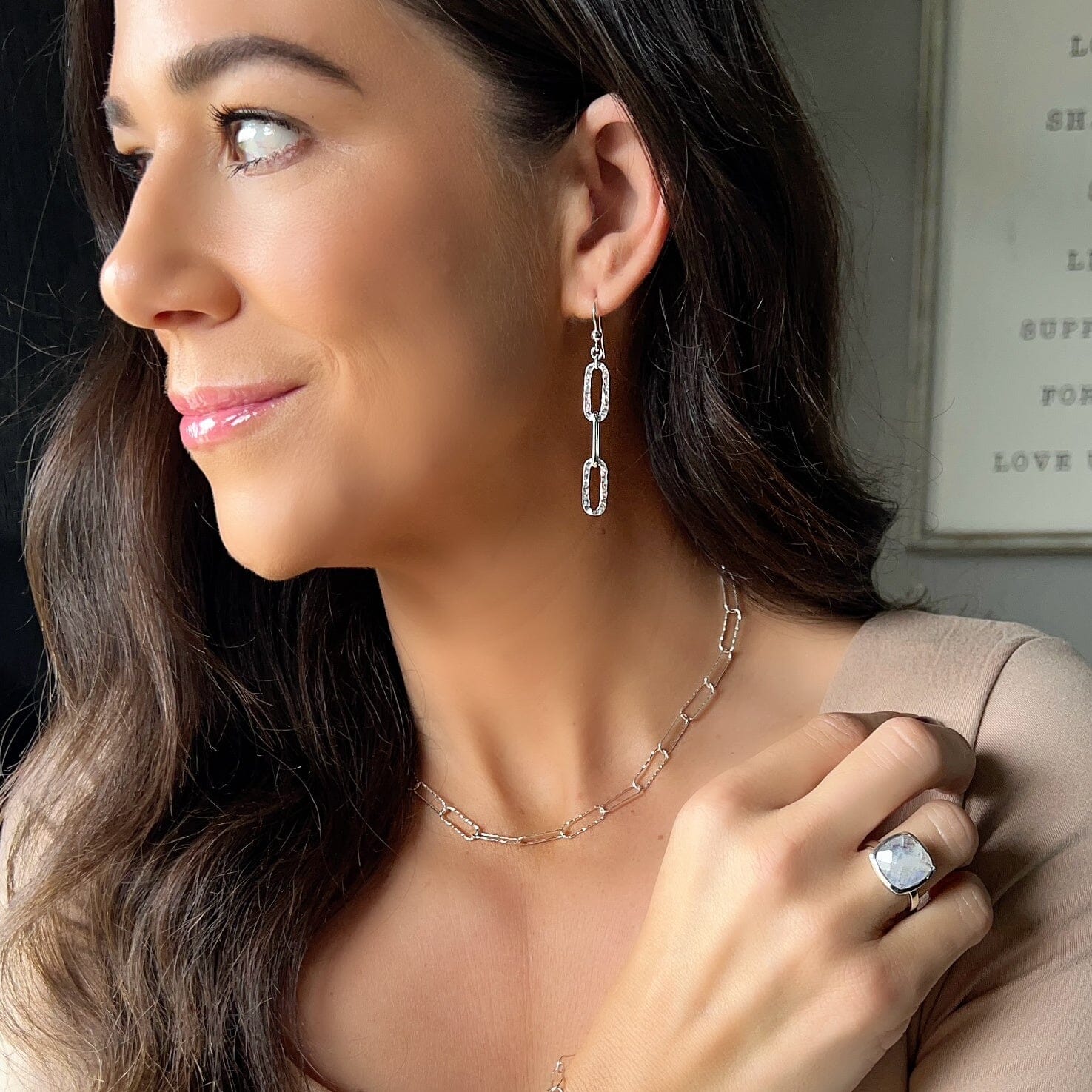 silver earrings with 3 dangling oval links with a hammered finish