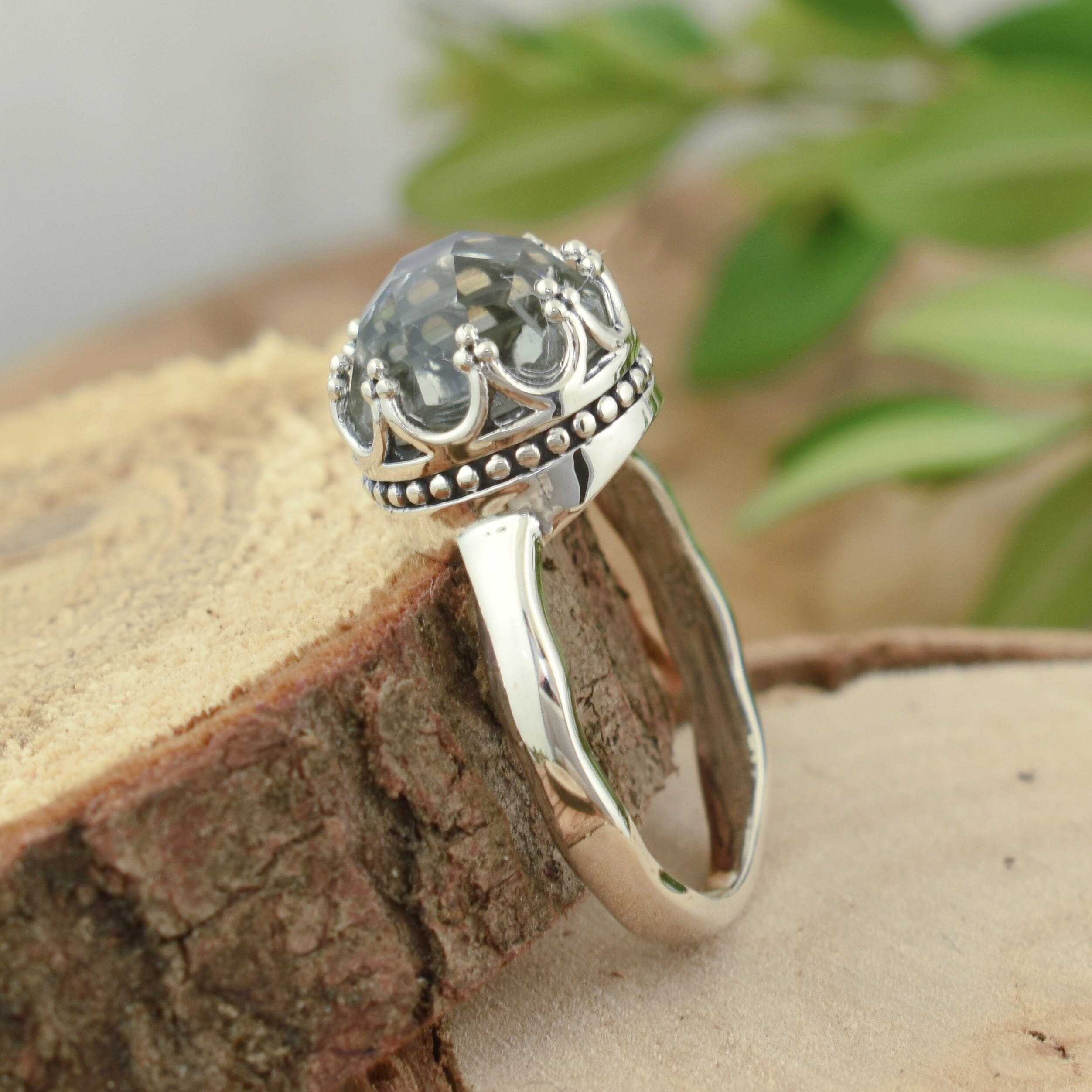 Crown-inspired ring with sterling silver and light green amethsyt stone
