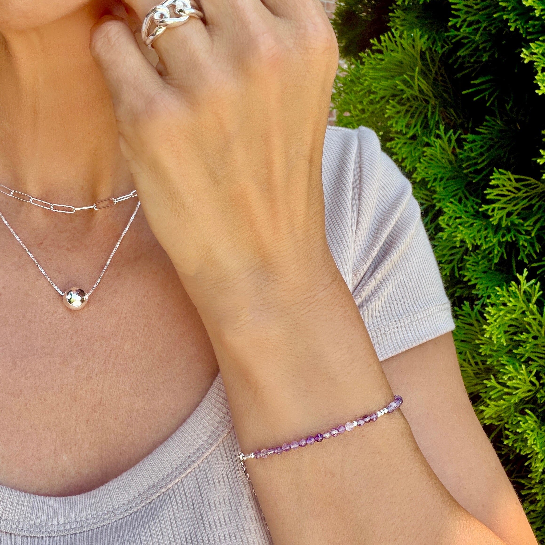 thin purple beaded bracelet