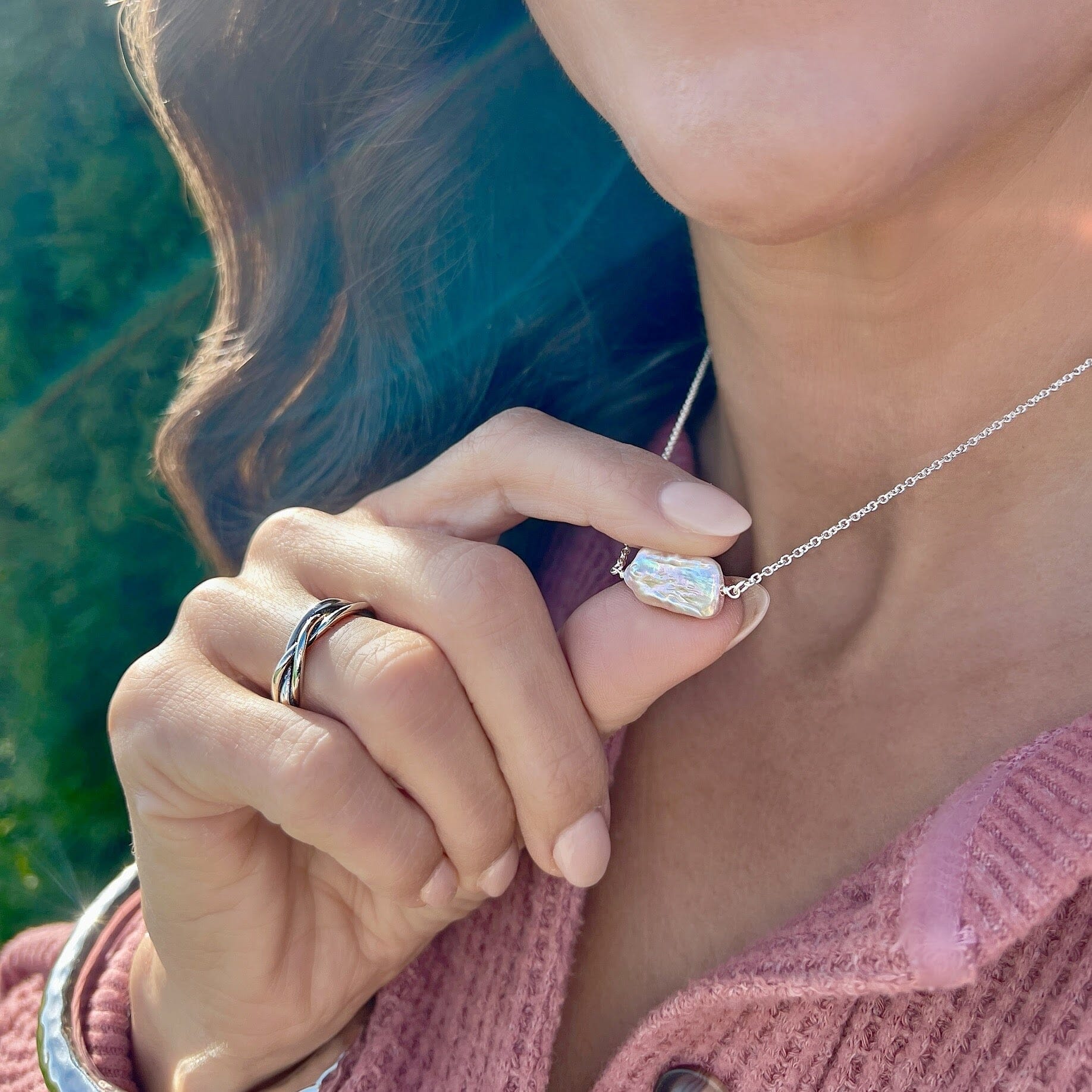 Sterling silver chain with a fresh water pearl in the center