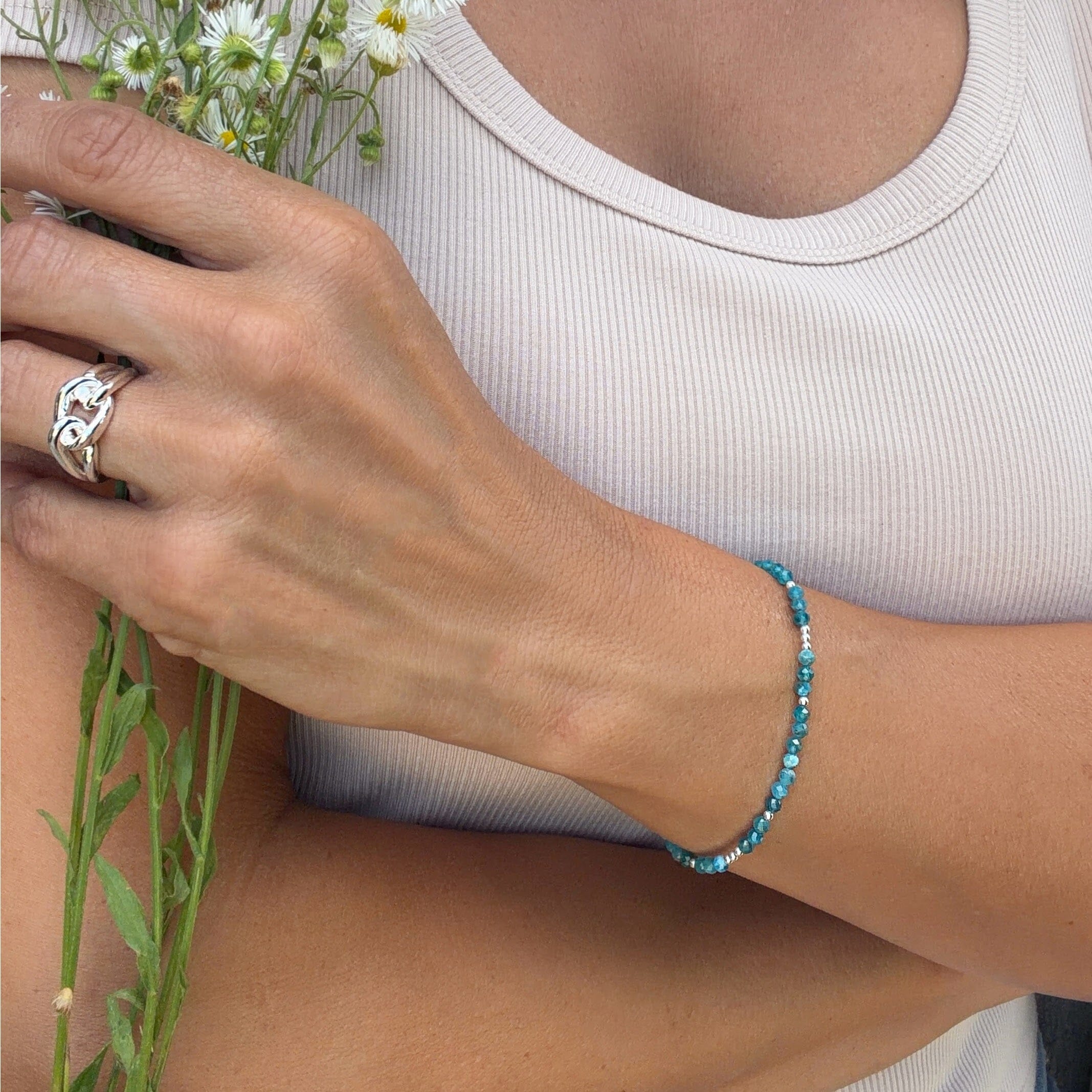 thin blue beaded bracelet