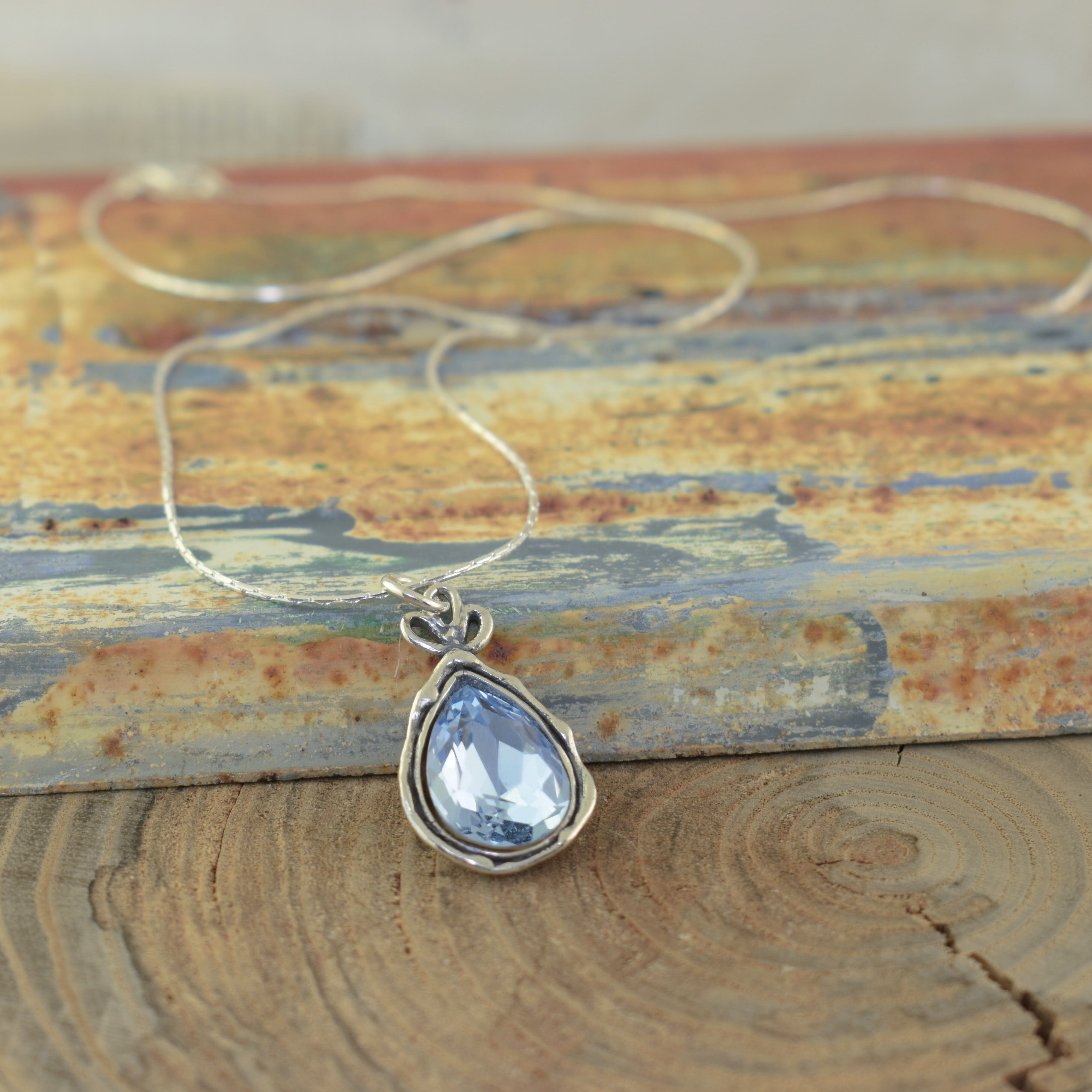 teardrop shaped pendant with organic sterling silver