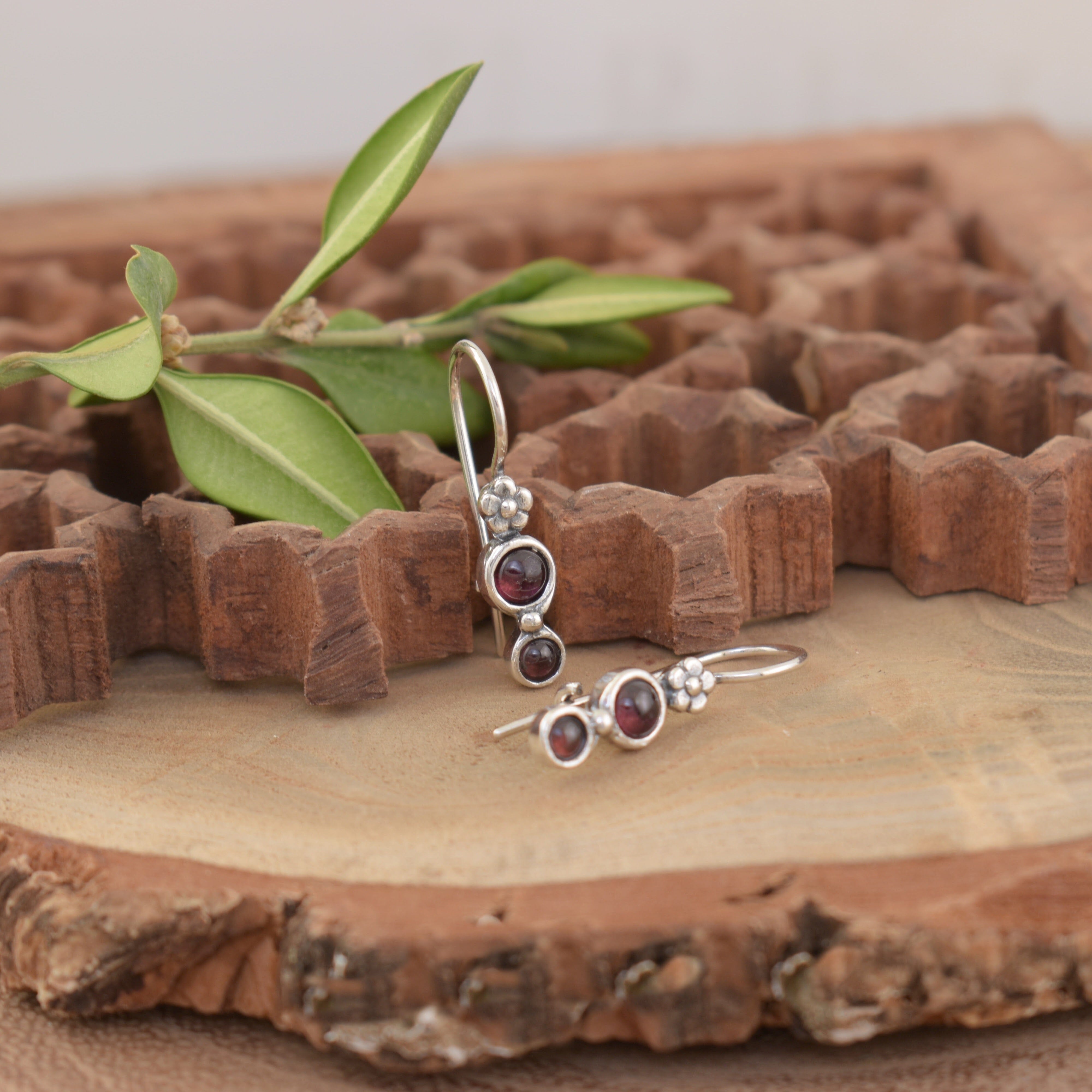 handcrafted garnet earrings with hand crafted flowers