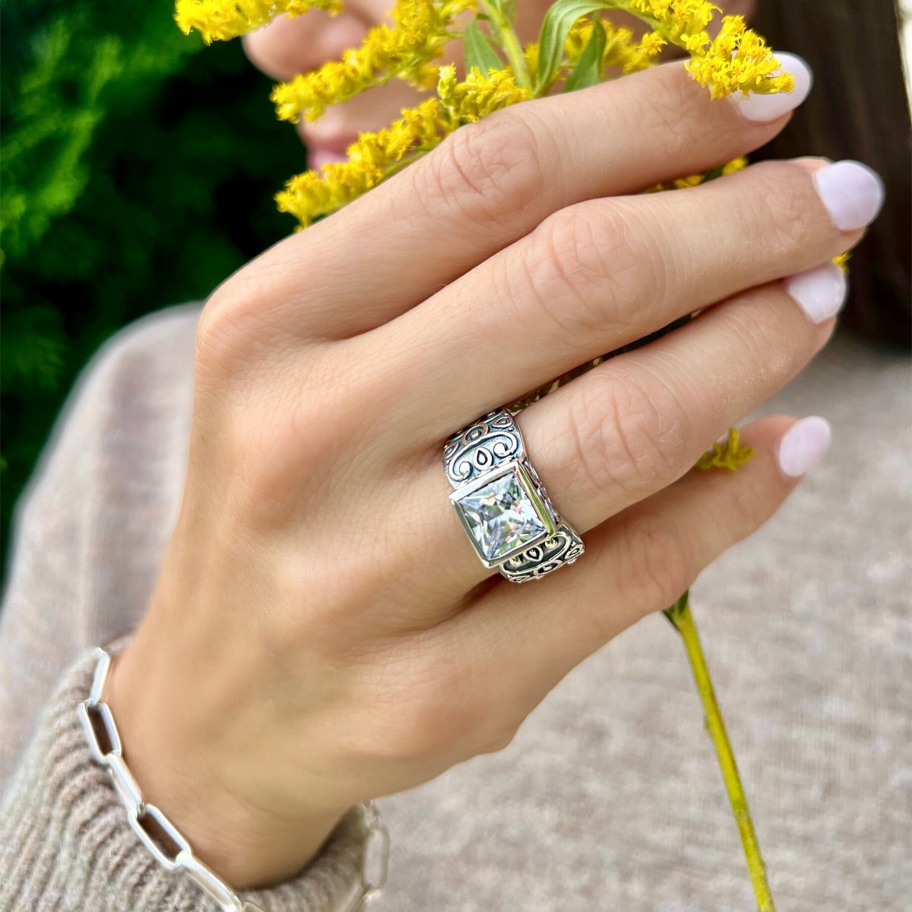 high polished and oxidized silver ring featuring square-cut cz