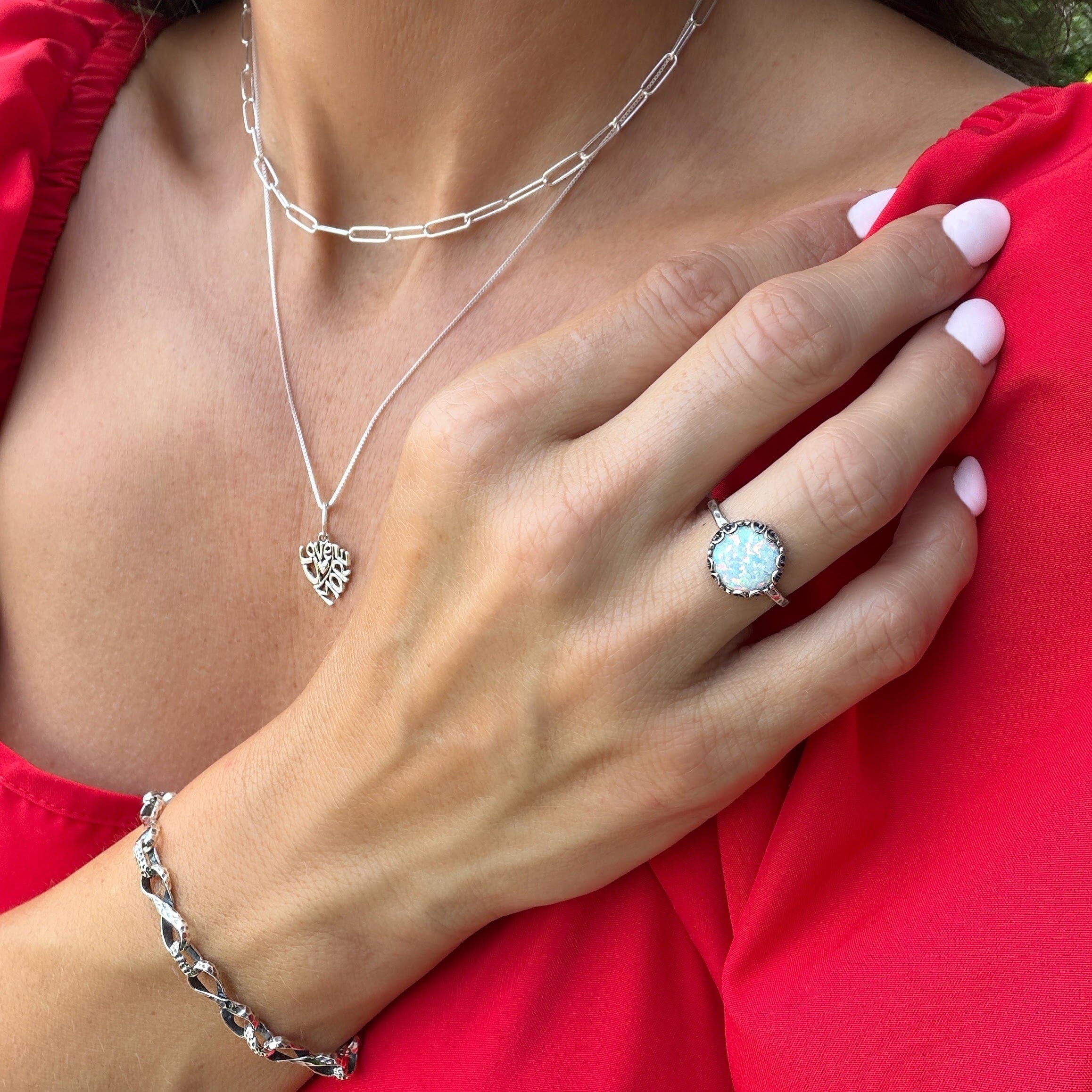white opal filigree ring with a minimalist style band