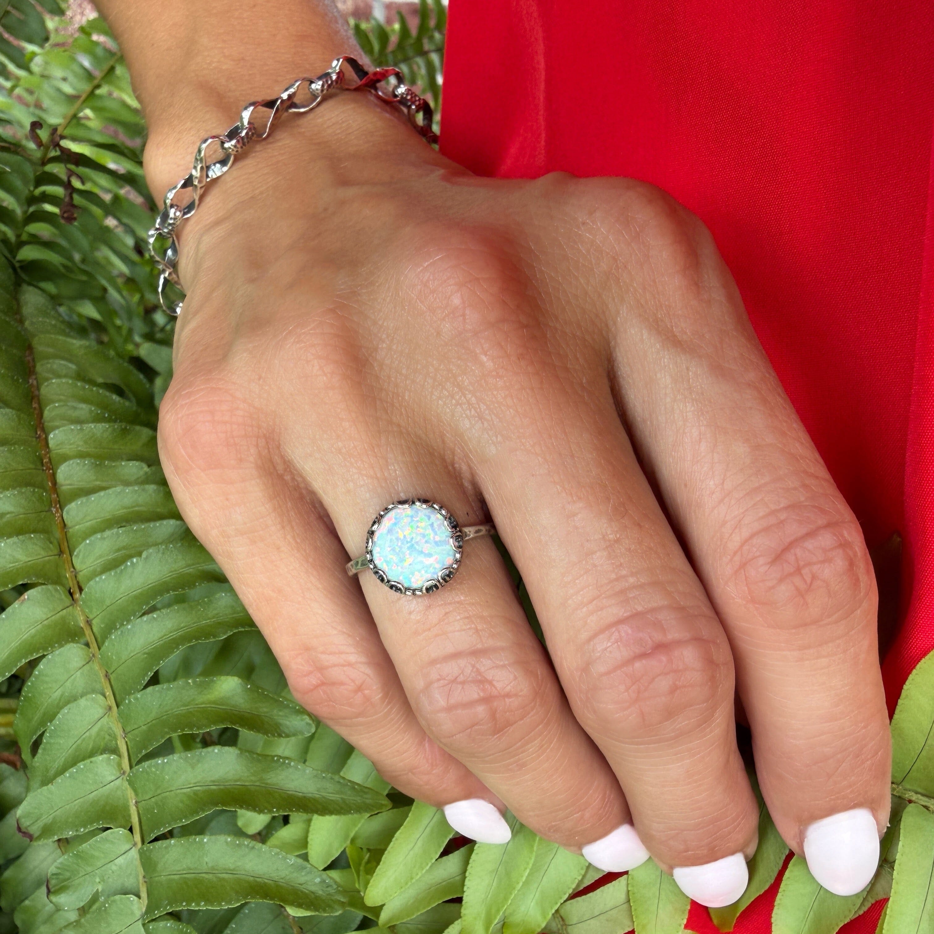 .925 sterling silver ring featuring bezel-set reconstructed opal