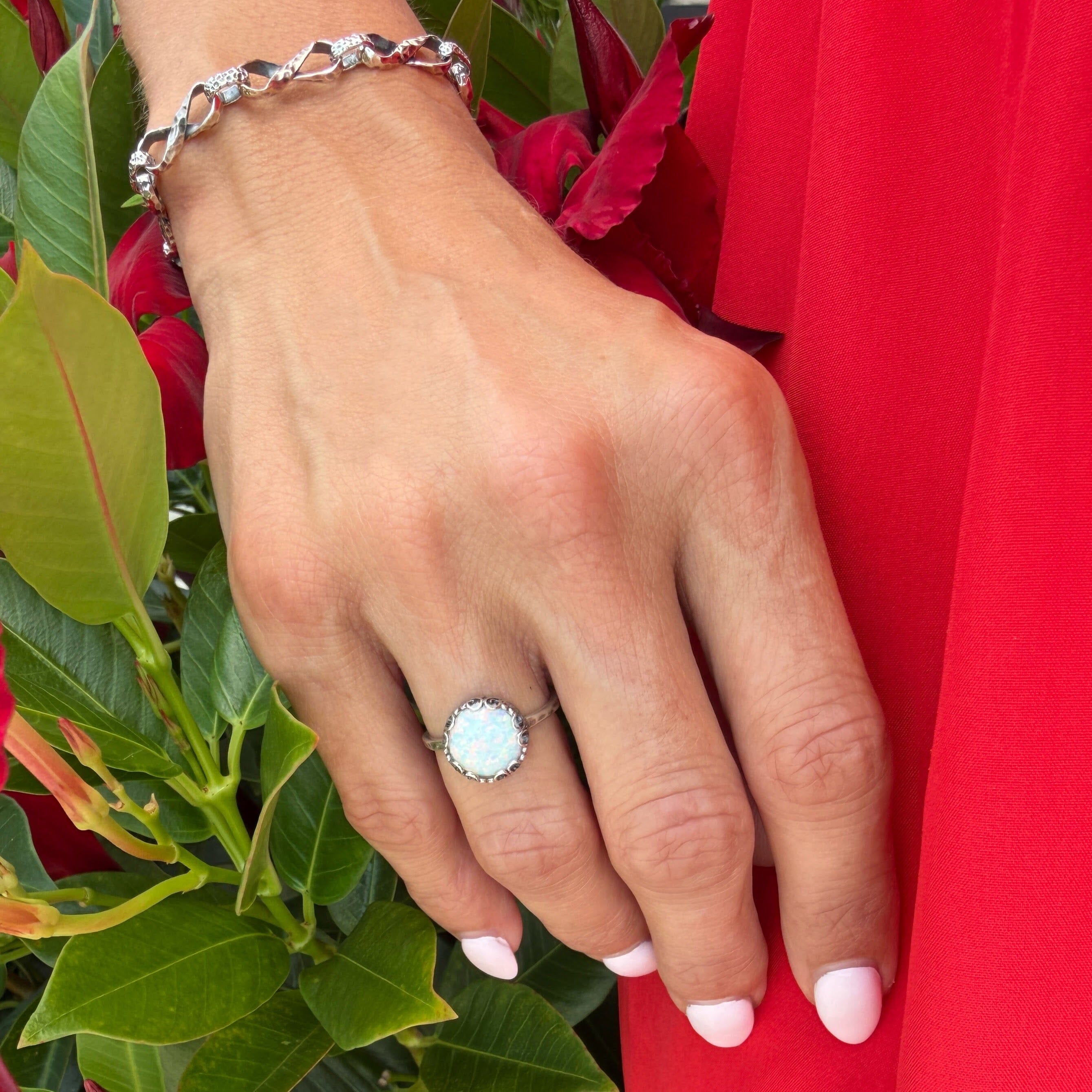 filigree bezel ring featuring reconstructed white opal