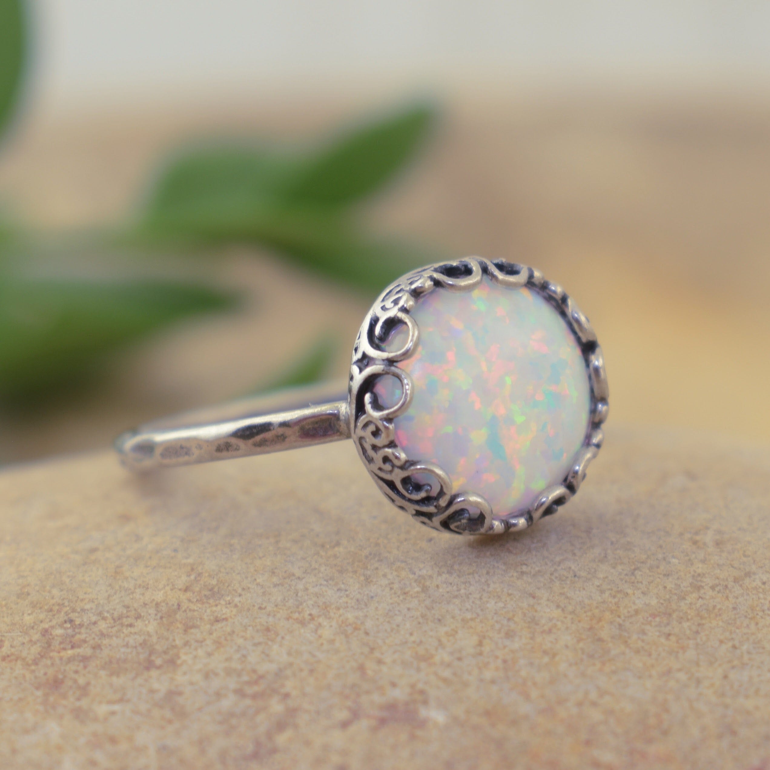 hammered oxidized ring with swirls and an opal stone