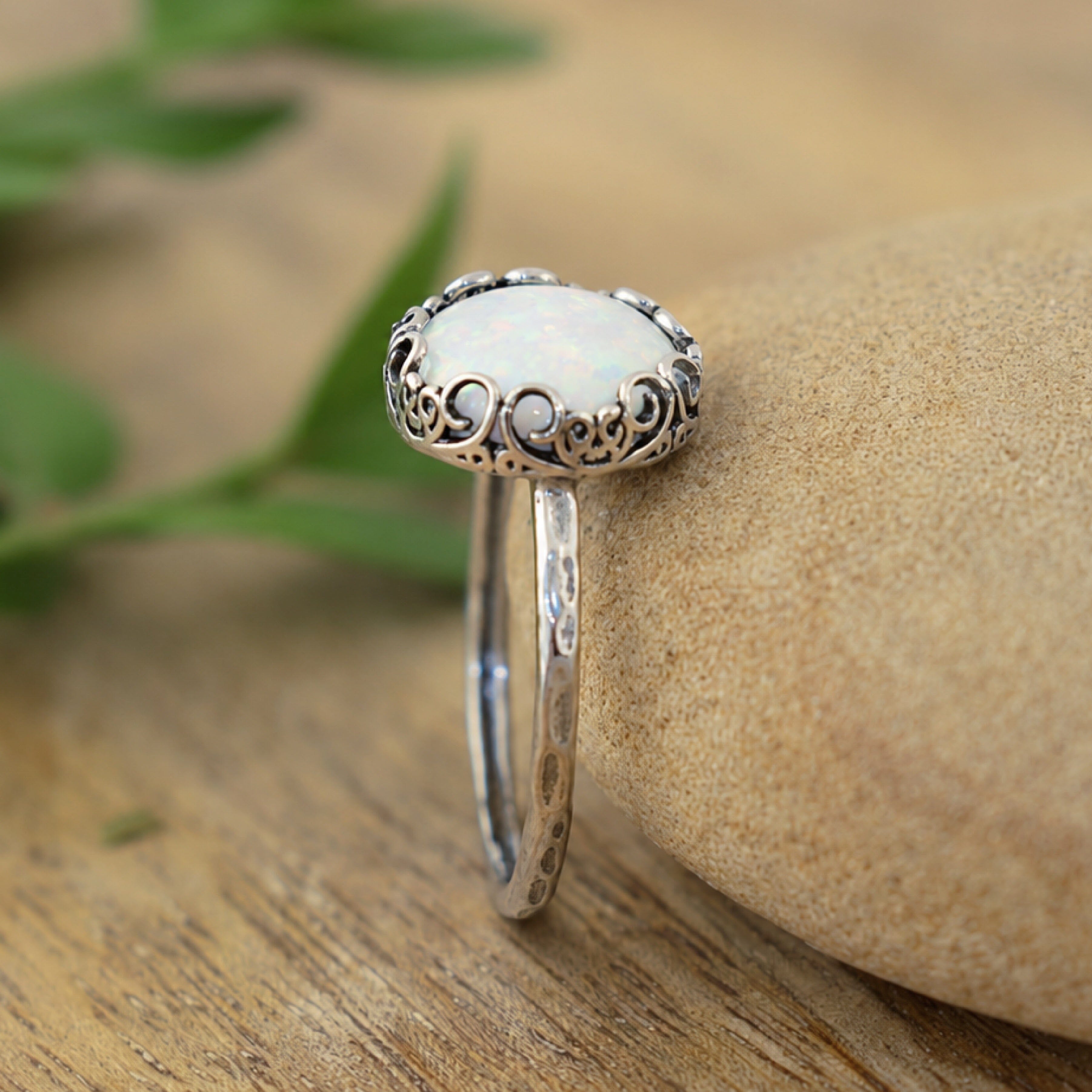 A sterling silver ring with a white opal stone