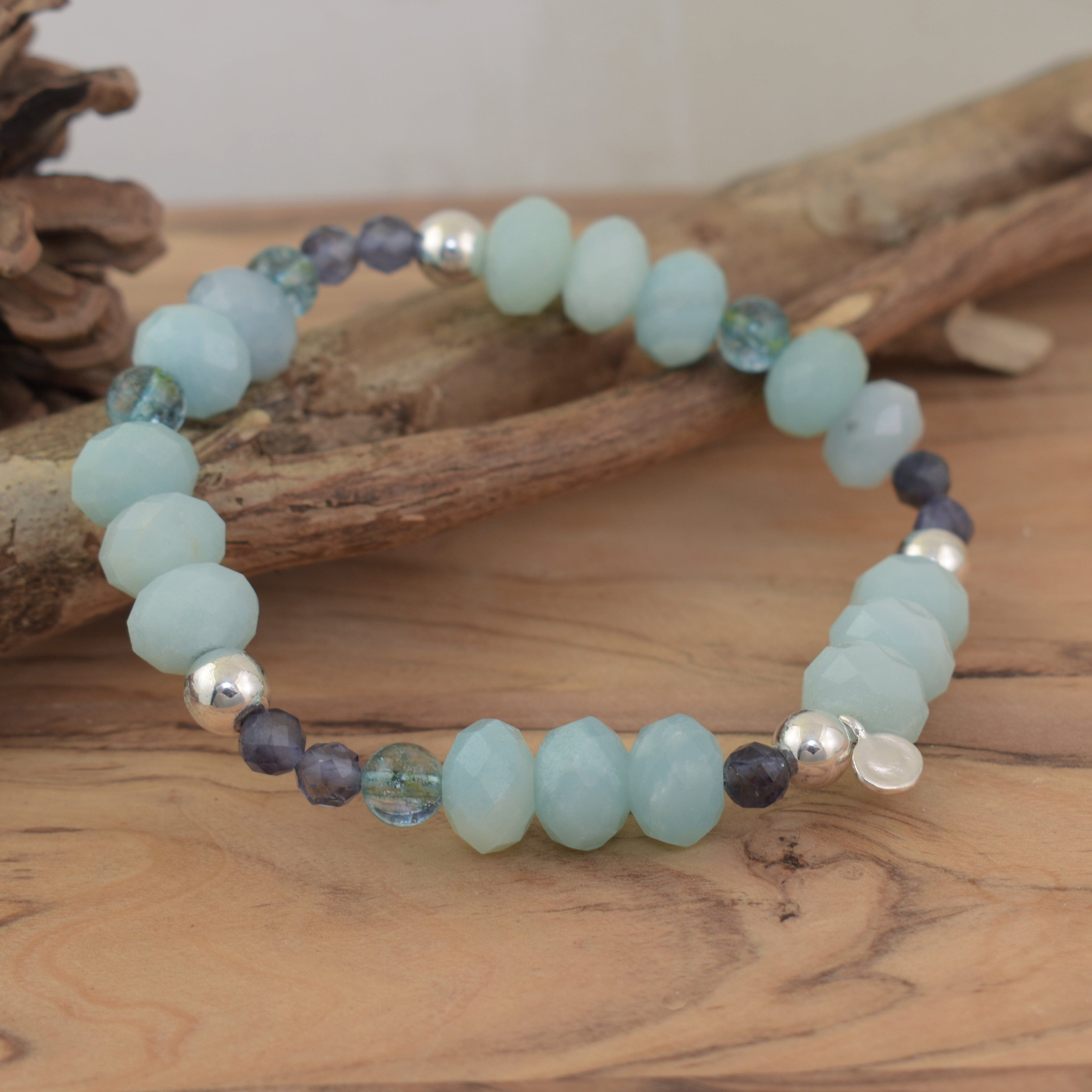 Seafoam Bracelet featuring various blue and green gemstones