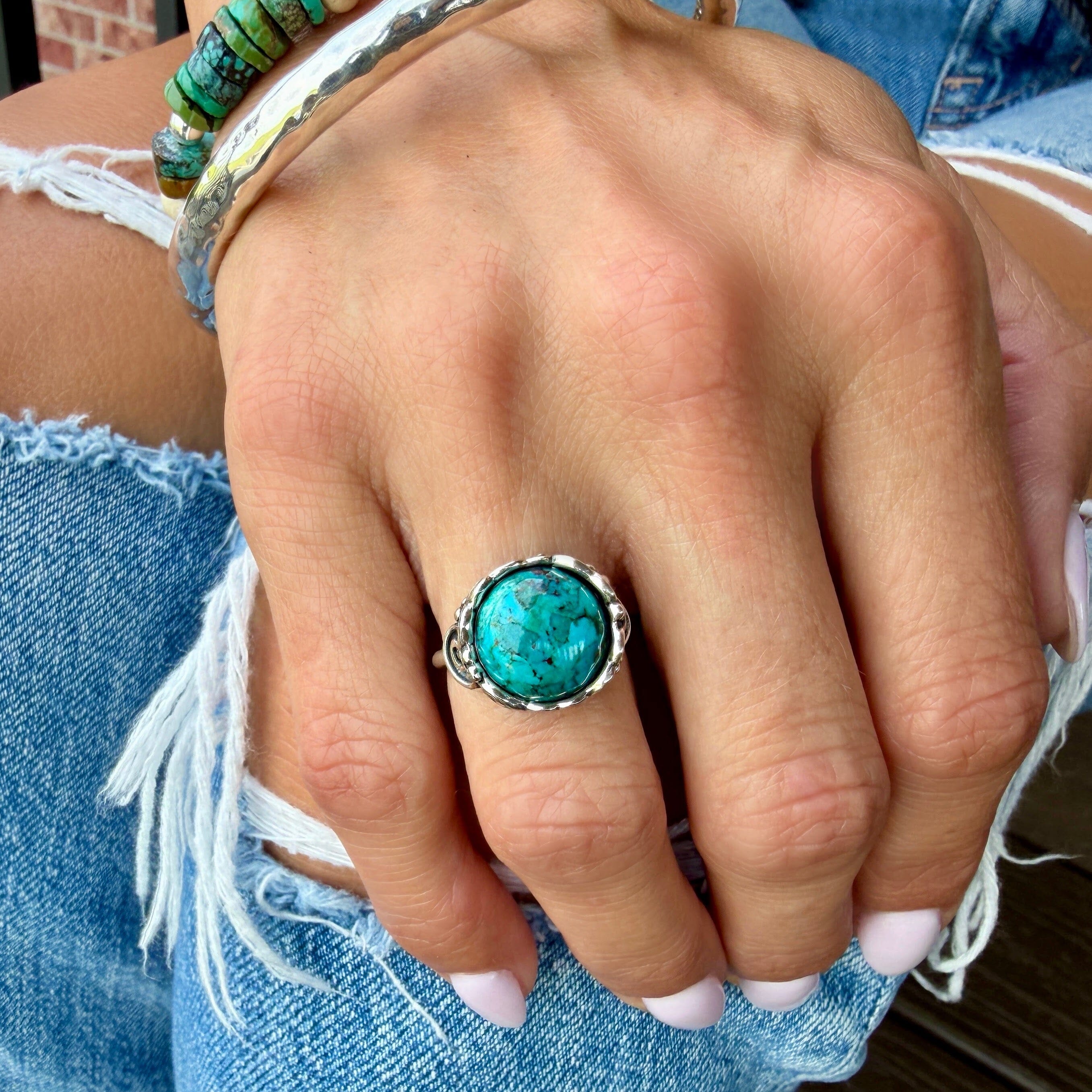 reconstructed turquoise bezel set in a handcrafted sterling silver ring