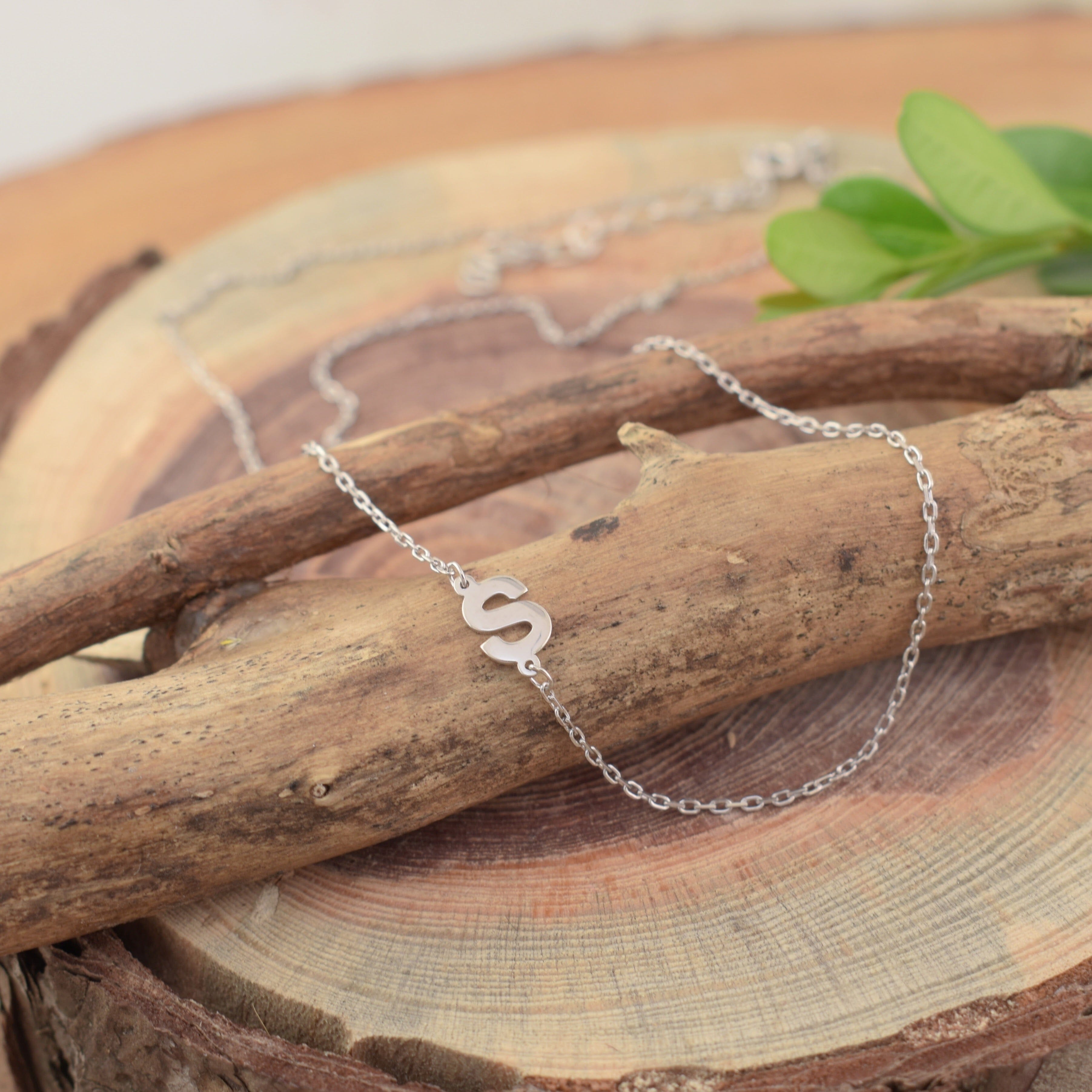 .925 silver with an initial pendant in the chain