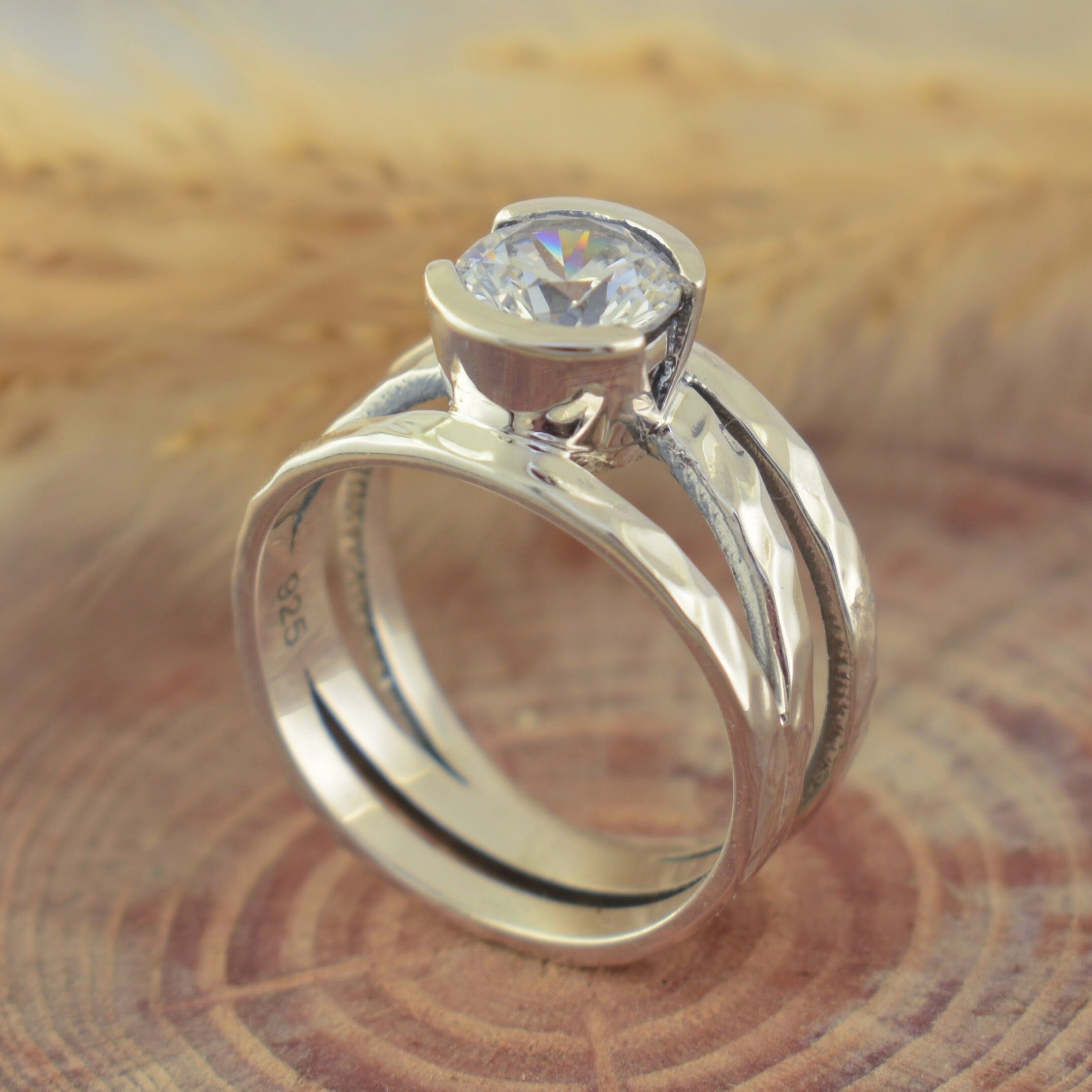 wide band sterling silver ring with a bezel set cz stone