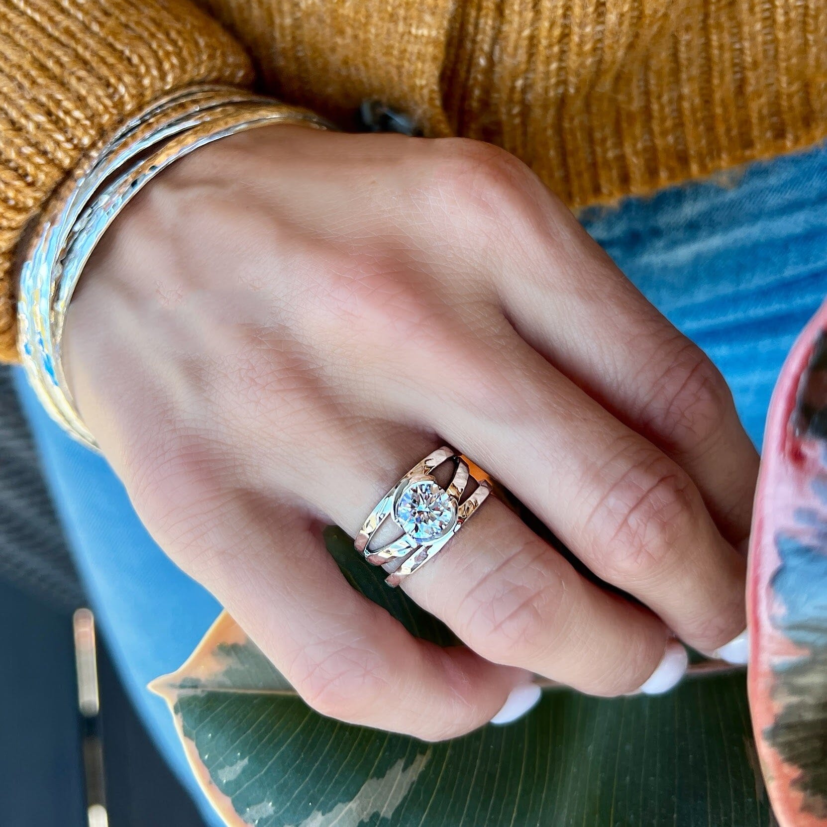 three silver hammered bands soldered into one ring with a center cz stone