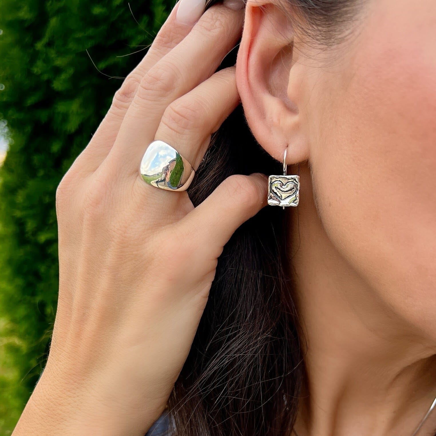 square dangling earrings with a center heart stamp