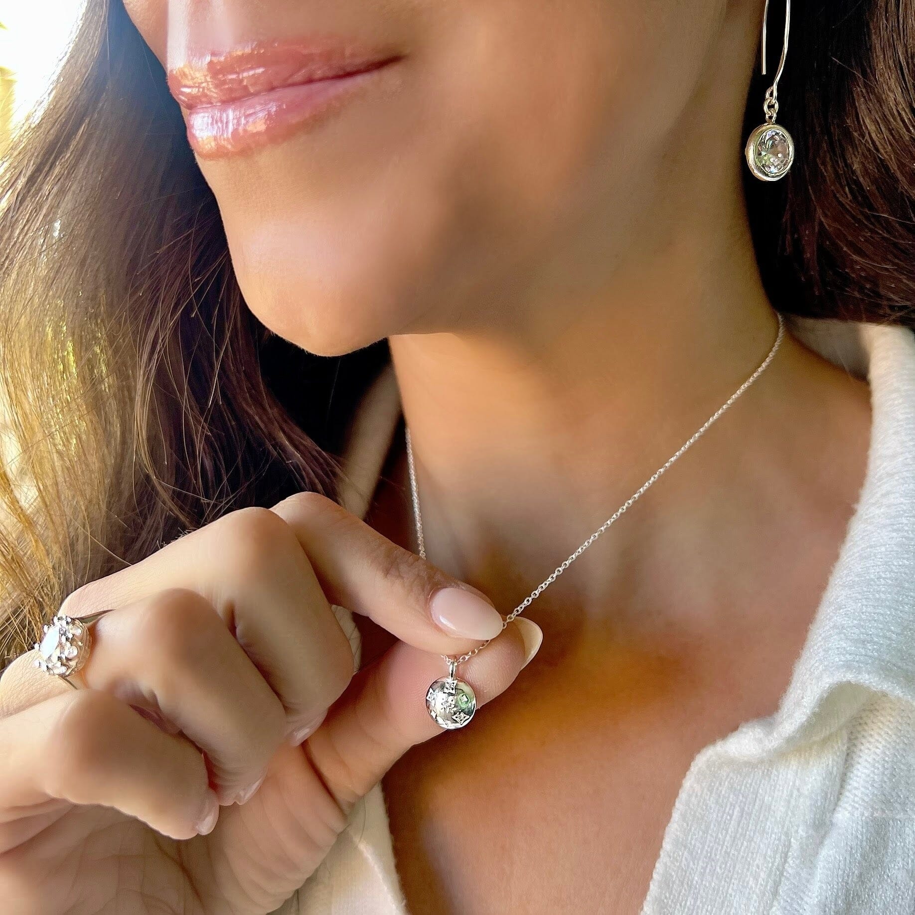 Sterling silver round high polished pendant with Cz stones