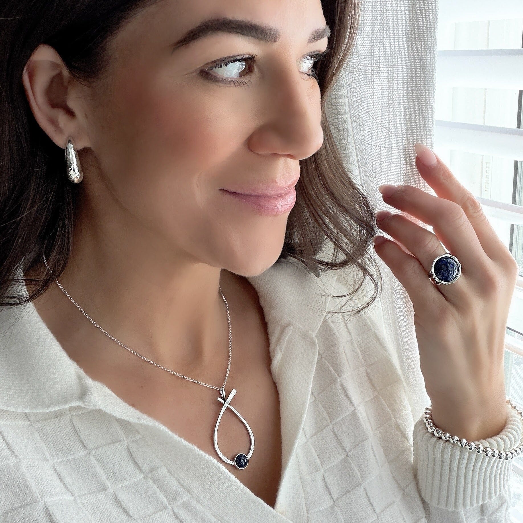 Stillpoint Necklace paired with sterling silver jewelry