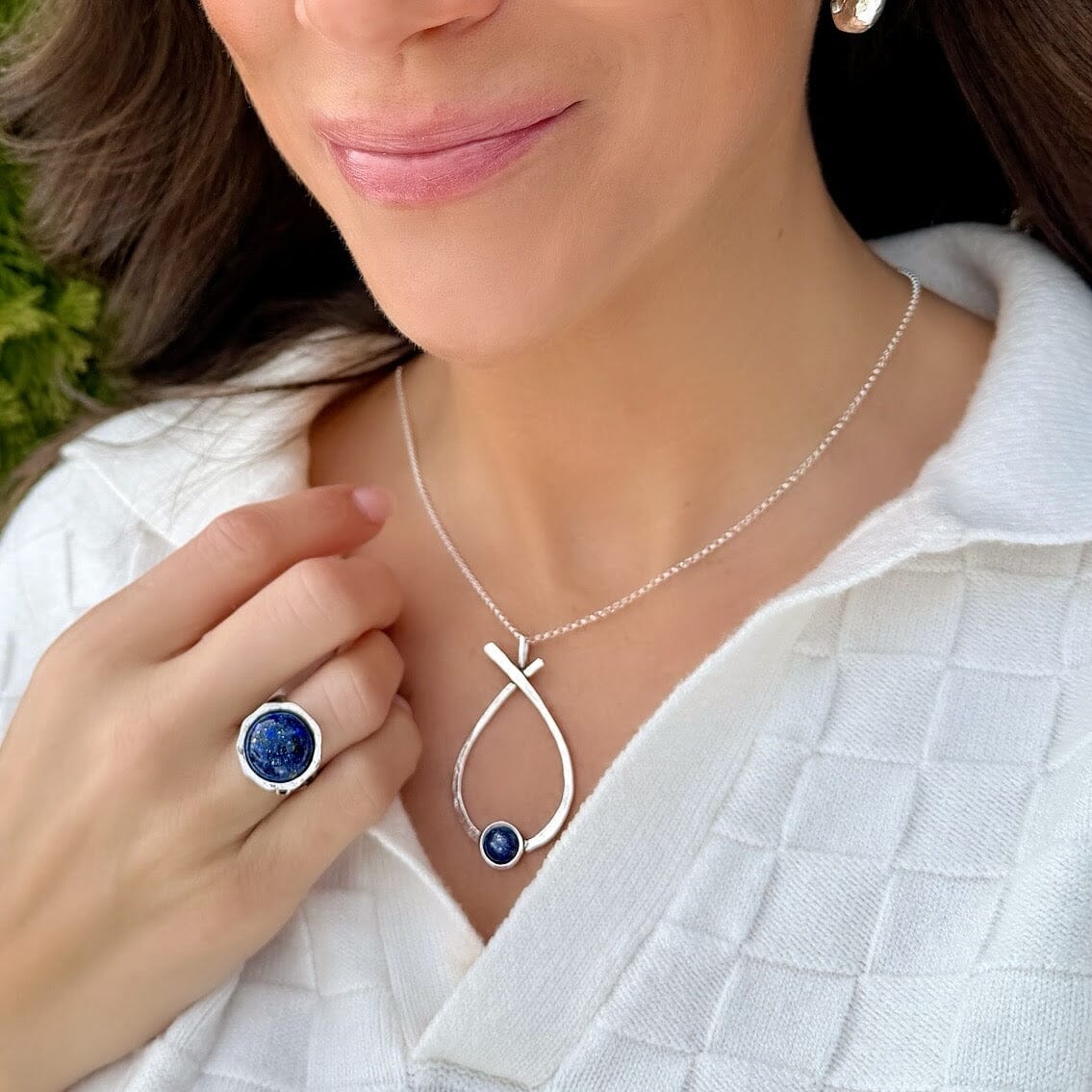 silver designer necklace featuring round lapis stone