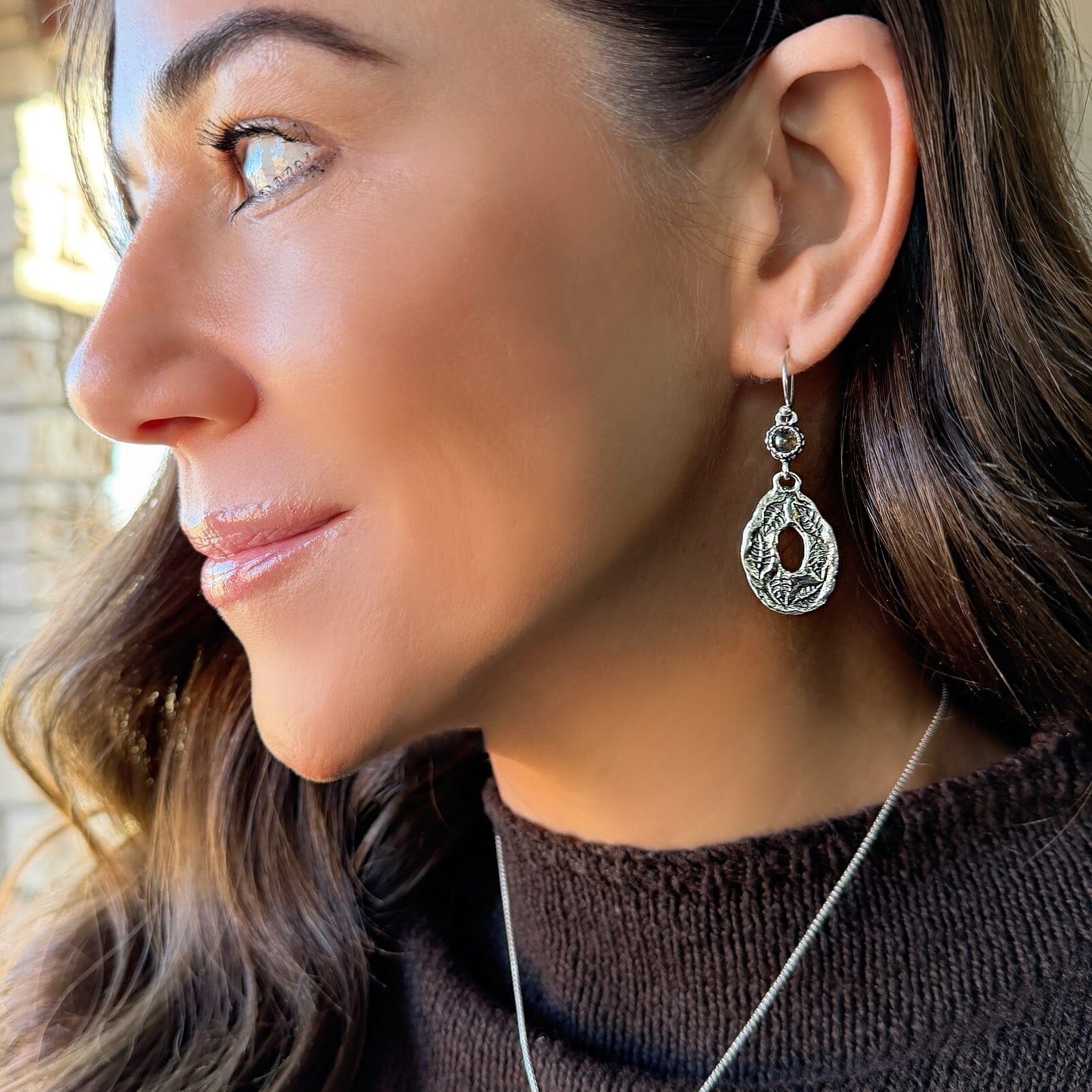 sterling silver dangling earring with a labradorite stone