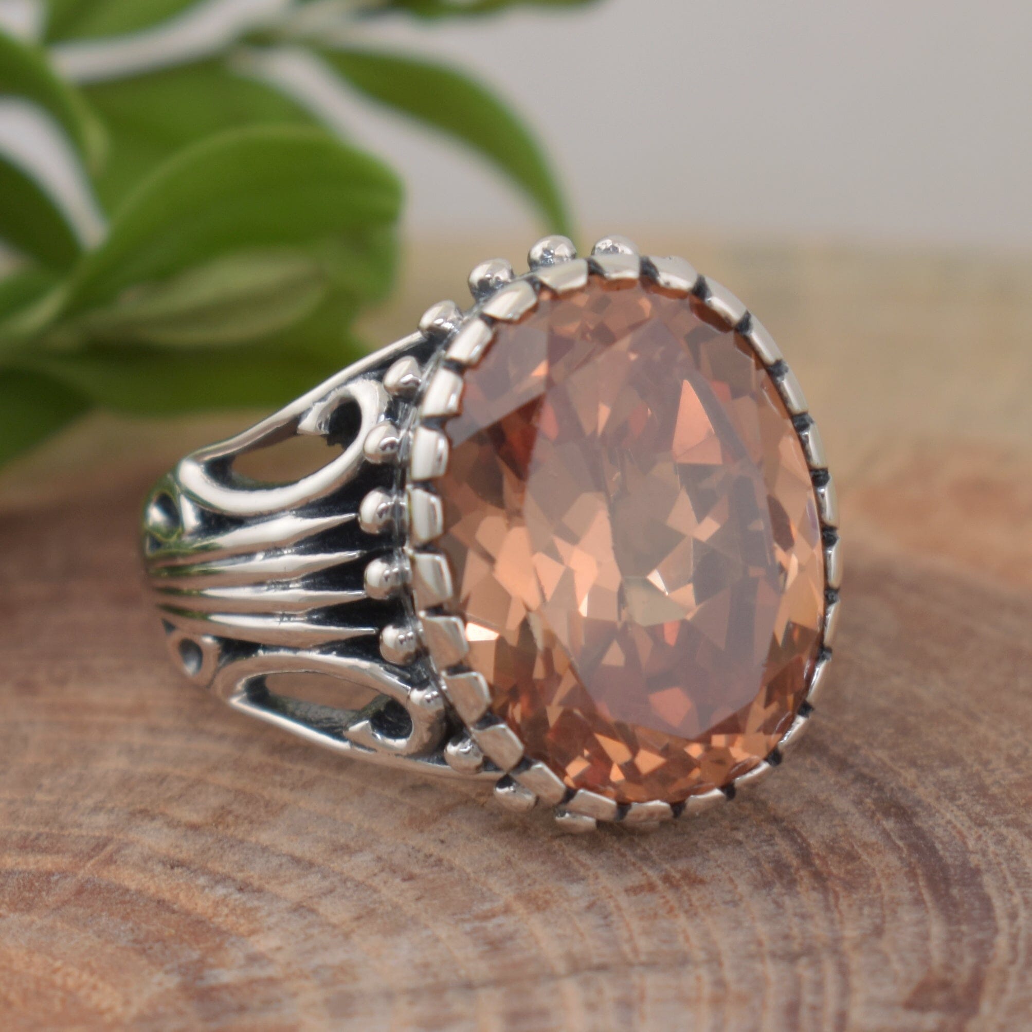 .925 sterling silver large statement ring featuring oval shaped champagne cz stone