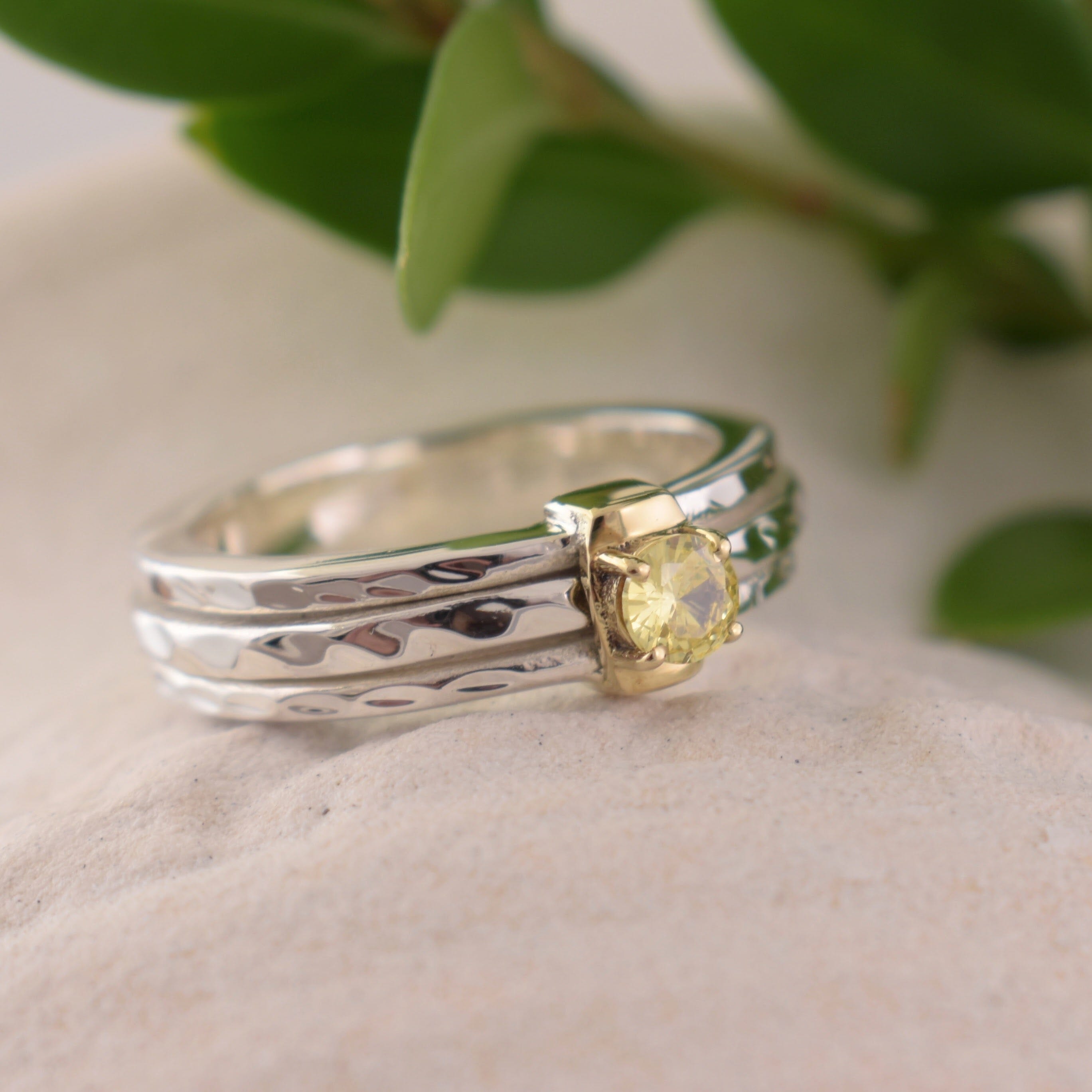 Yellow CZ stone prong set in a brass plated setting