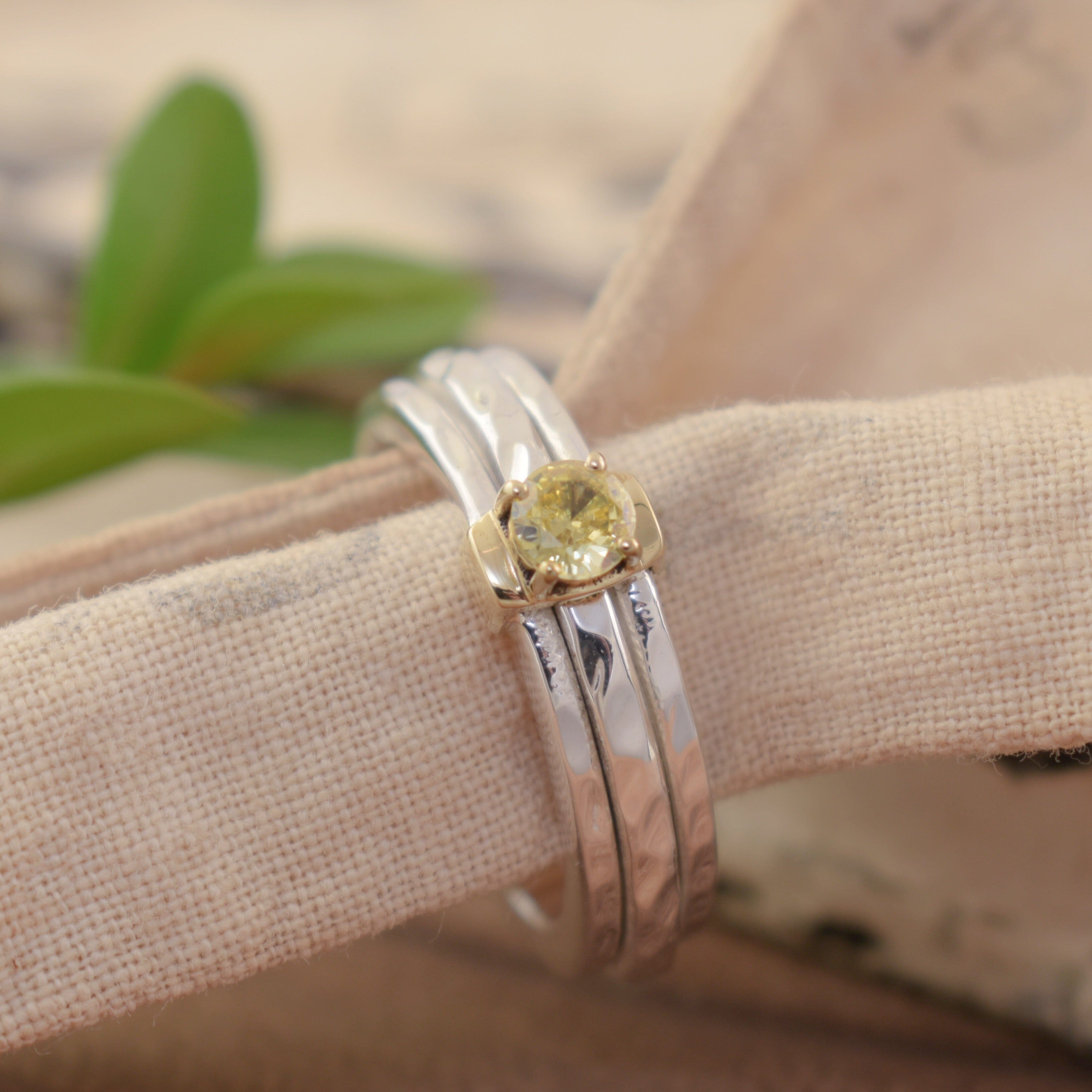 Spinner ring with a prong set stone