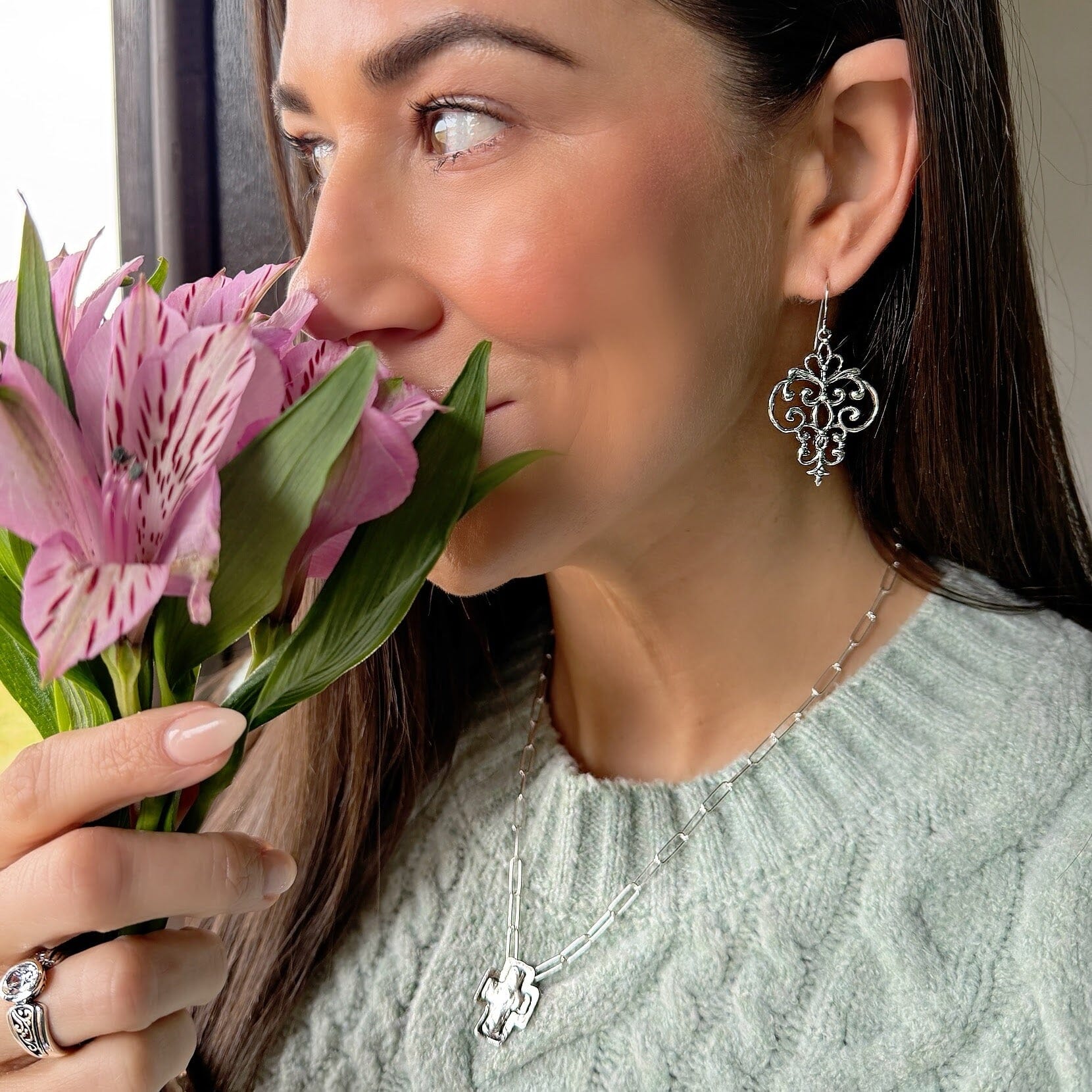 Swirl Girl earrings paired with the Santa fe cross necklace and radiant filigree ring